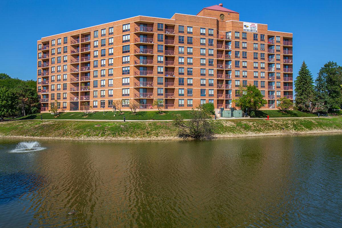 a building next to a body of water