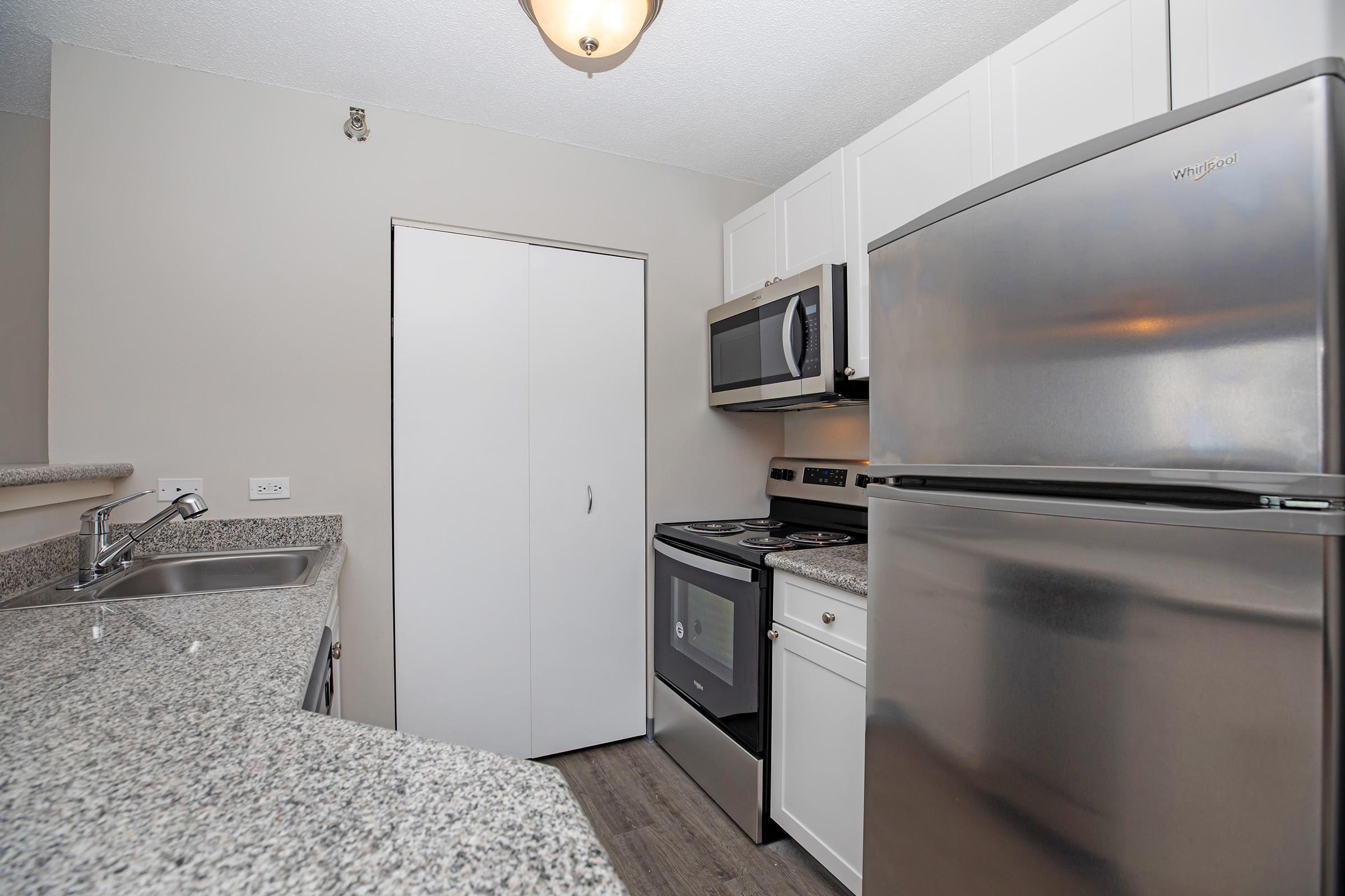 a stainless steel refrigerator in a kitchen