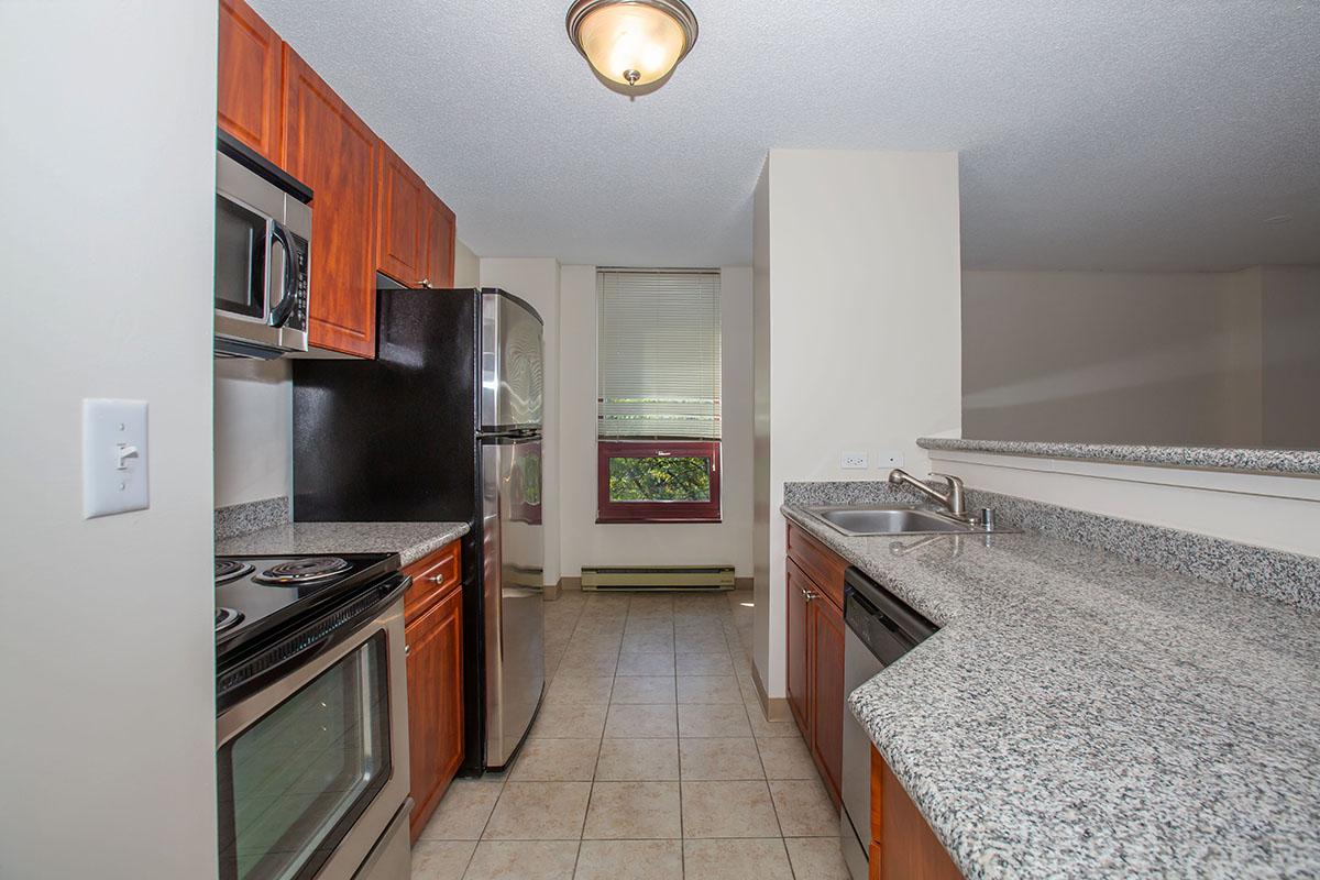 a kitchen with a sink and a refrigerator