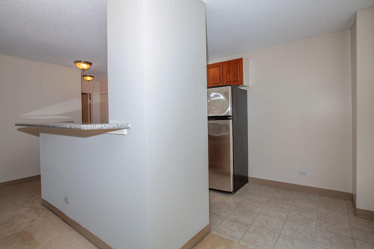 a large white refrigerator in a kitchen