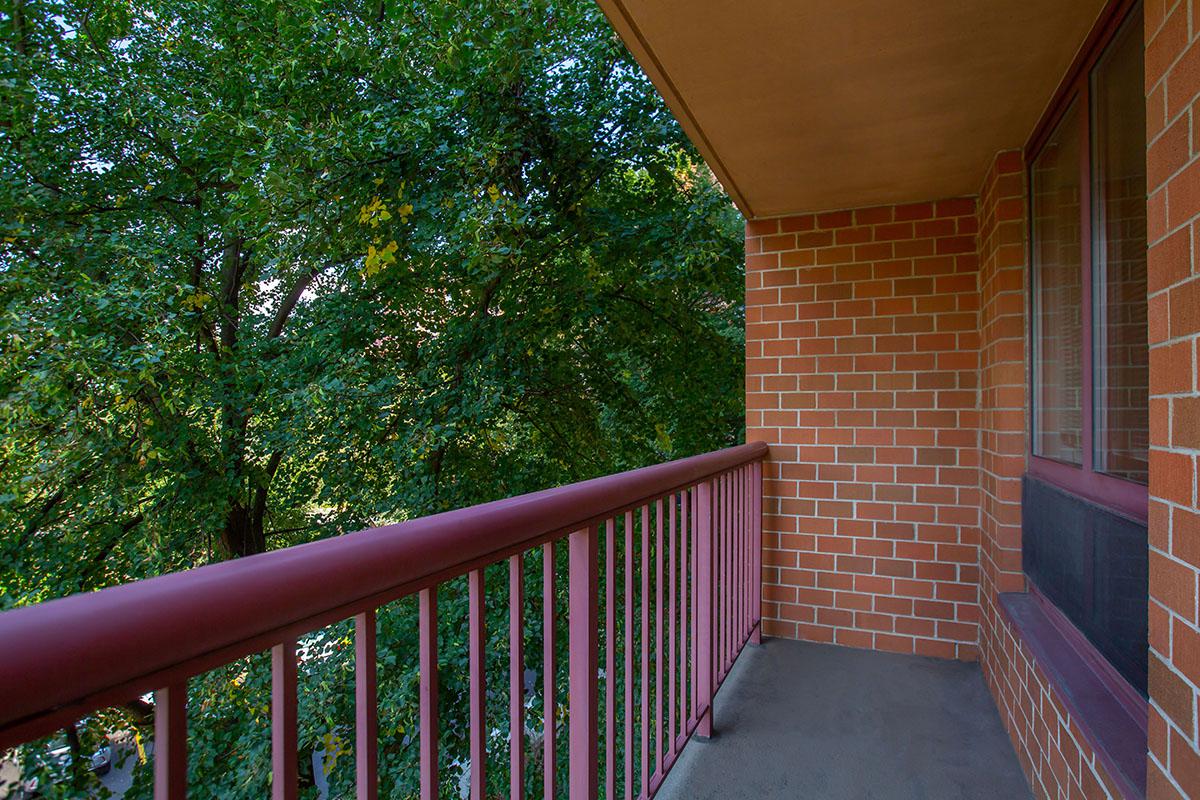 a close up of a red brick fence