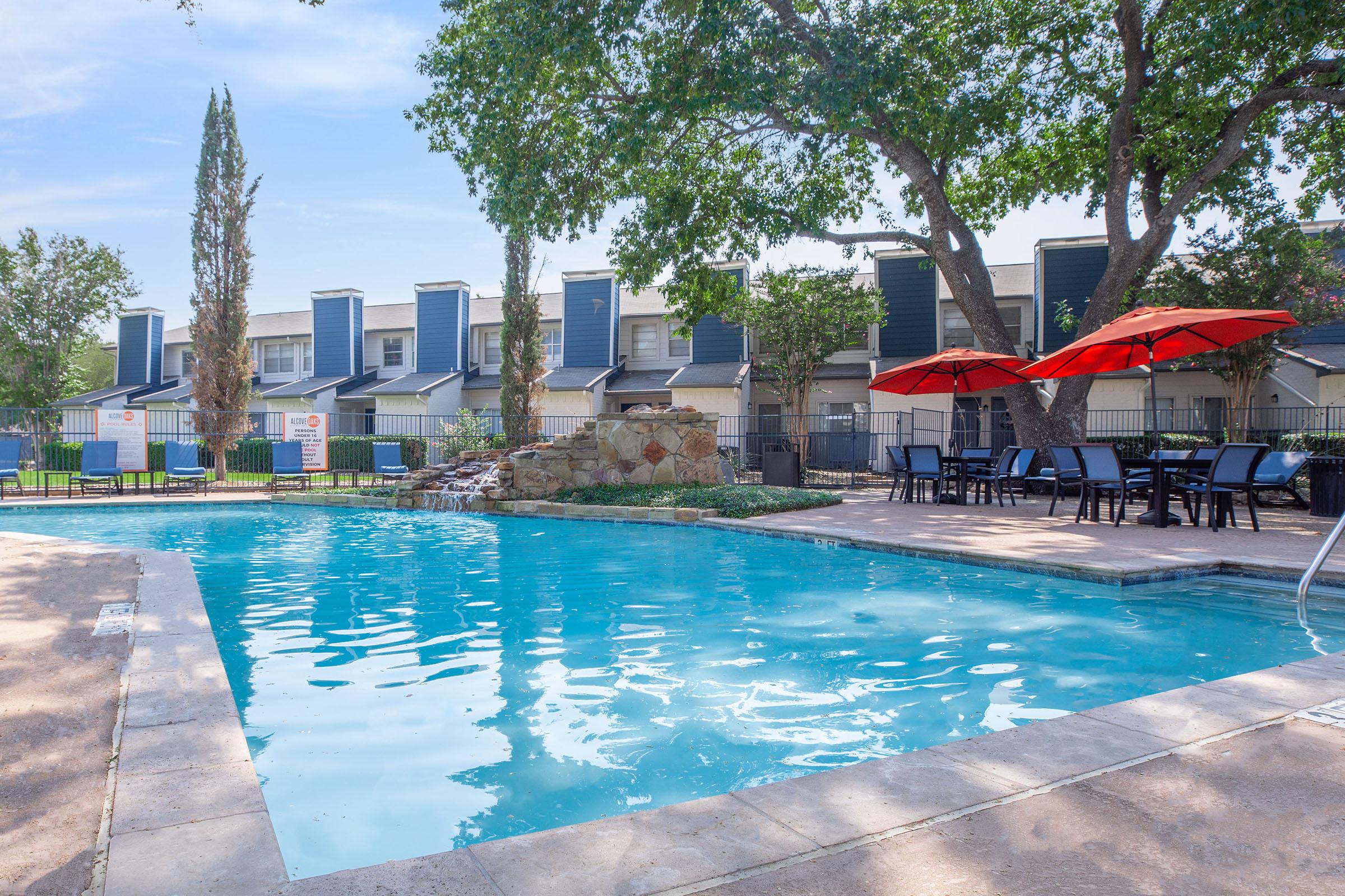 The resort-style pool surrounded by loungers at Rise North Arlington.