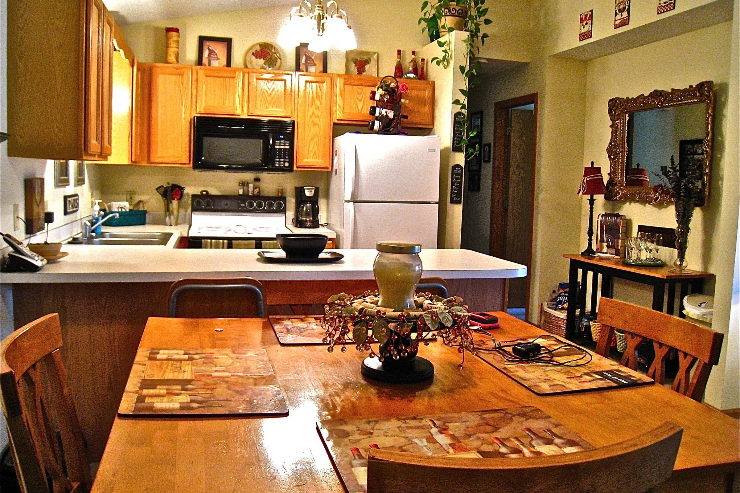 a kitchen with a dining room table