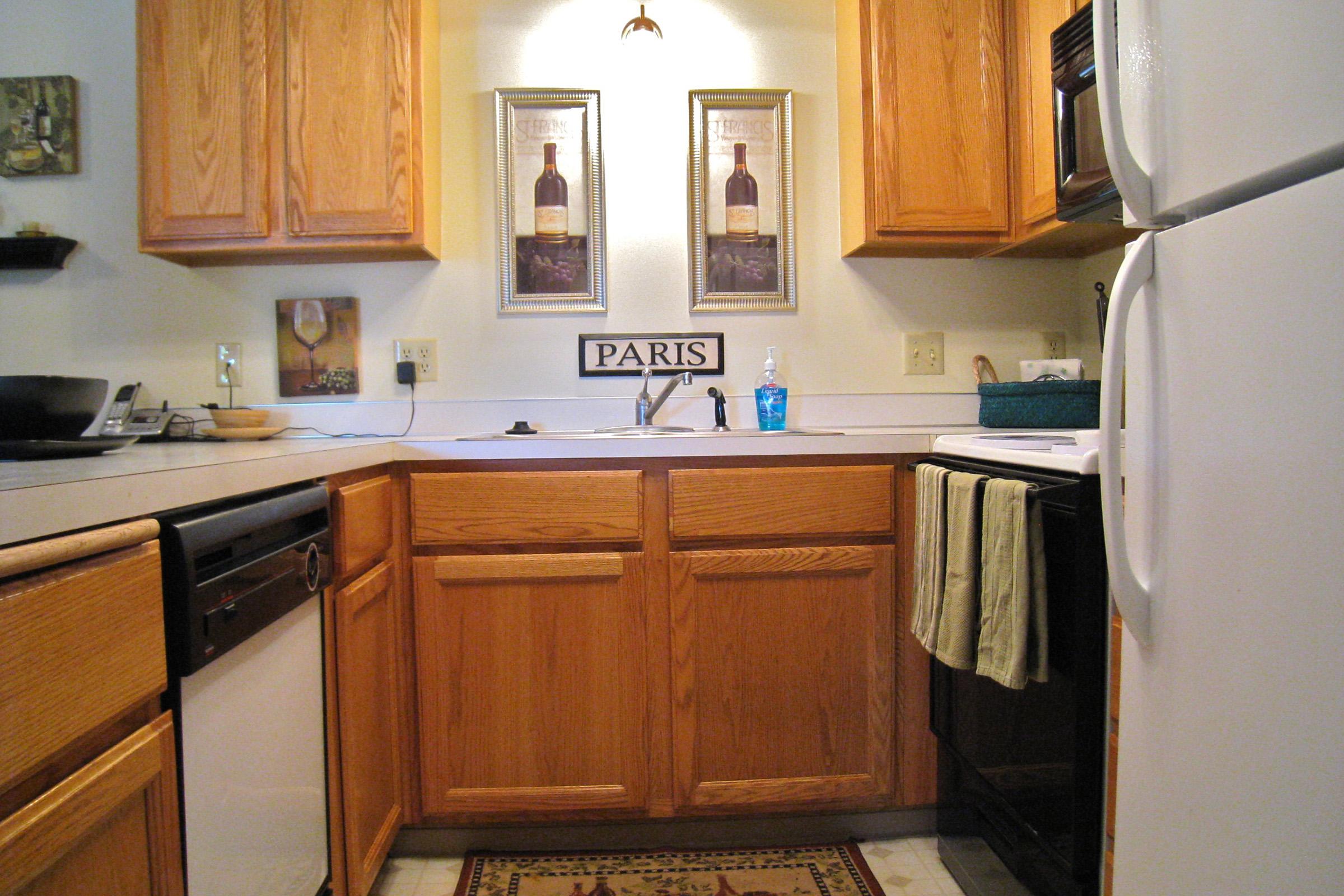 a kitchen with a stove top oven sitting inside of a refrigerator