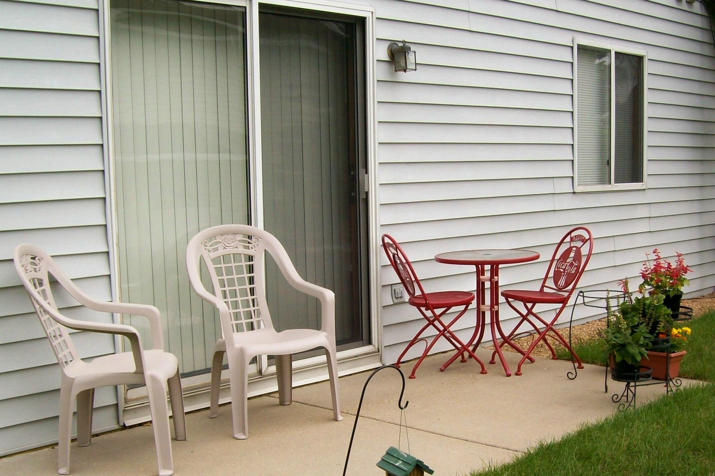 a chair sitting in front of a house