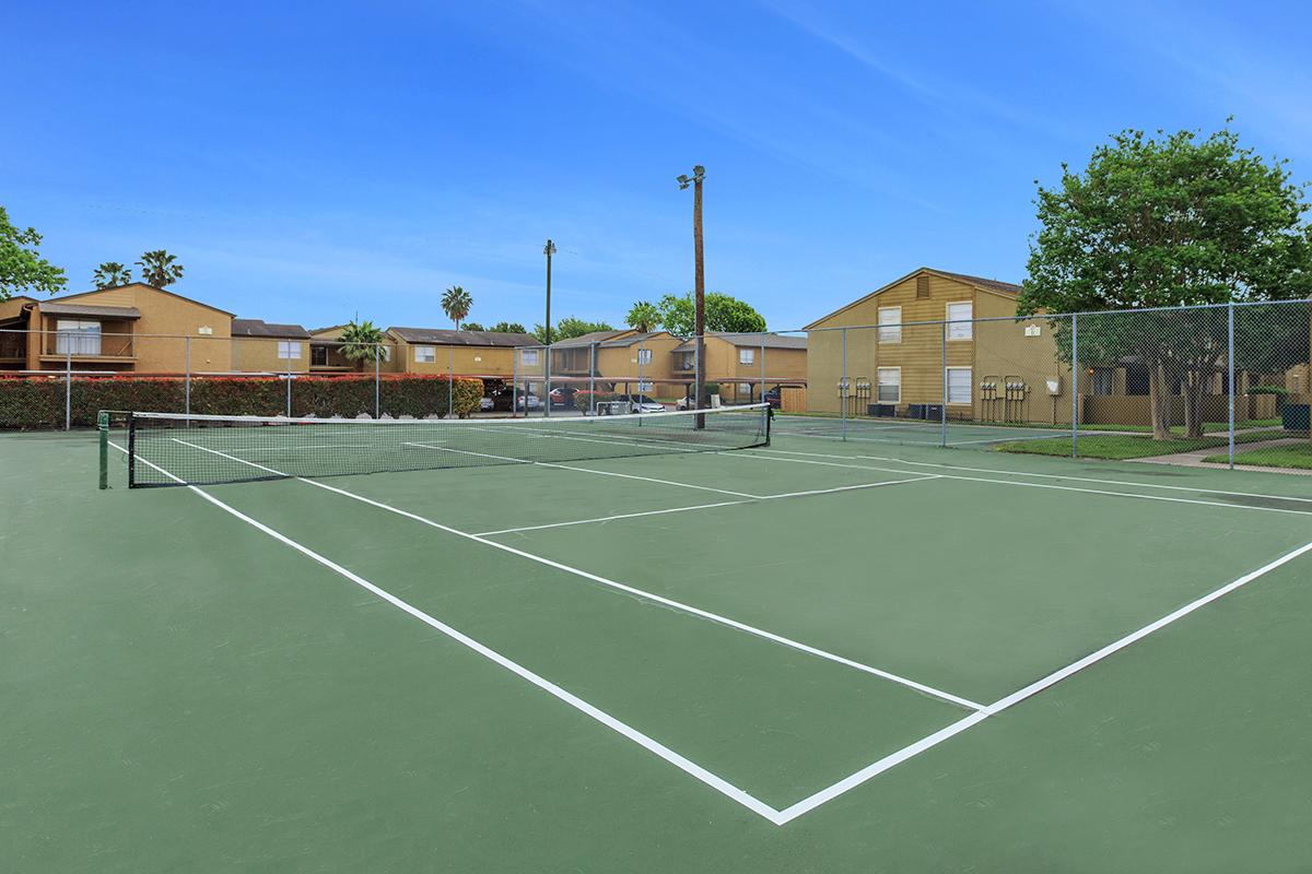 a person on a court with a racket