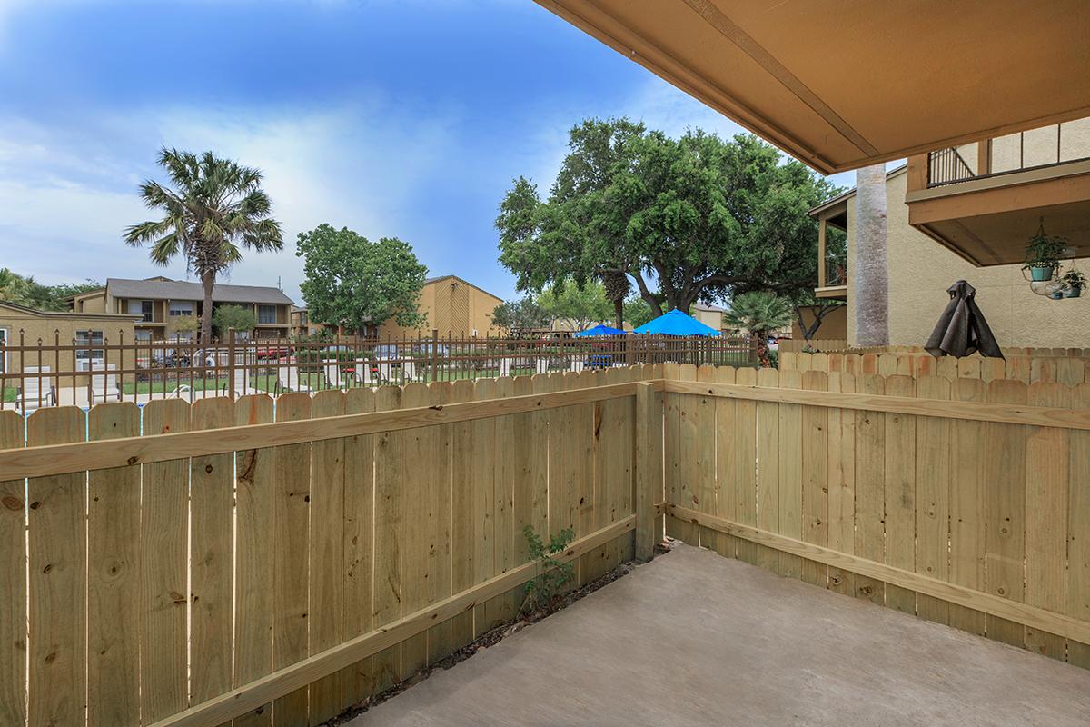 a building with a wooden fence