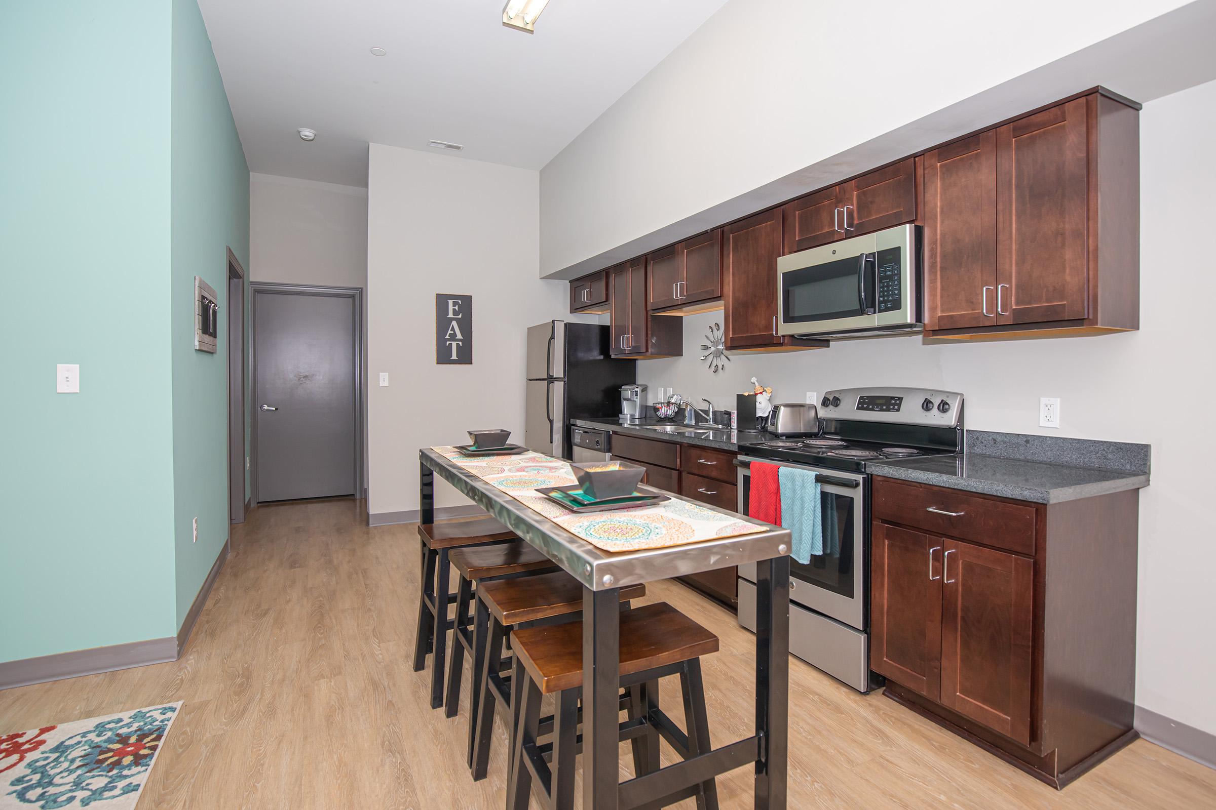 a kitchen with a wooden floor