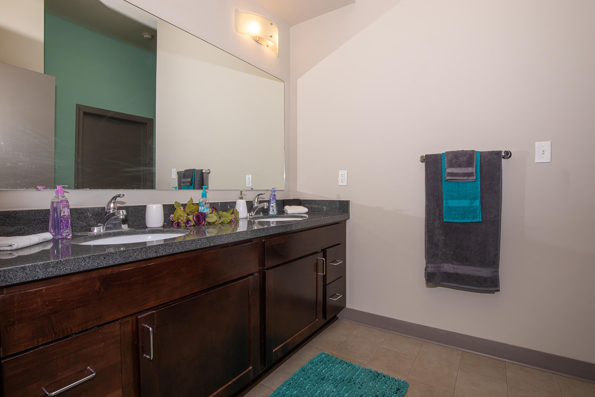 a kitchen with a sink and a mirror