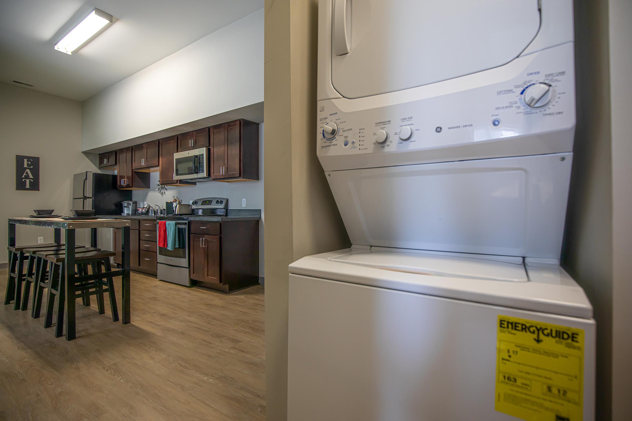 a kitchen with a stove top oven sitting inside of a refrigerator