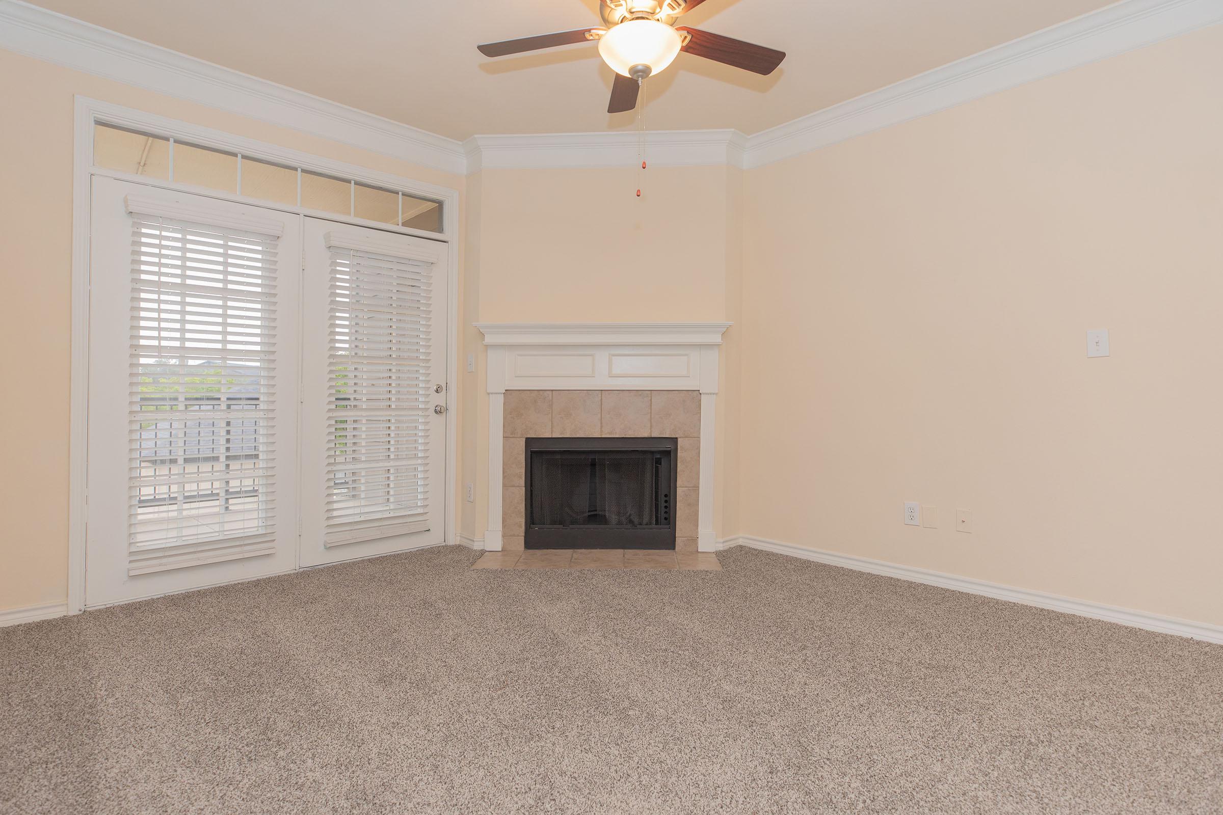 vacant living room with a fireplace
