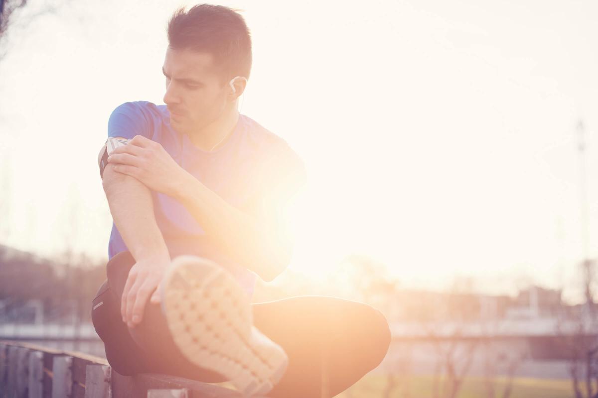 Athlete touching armband with mobile phone iStock_000061546064_Large.jpg