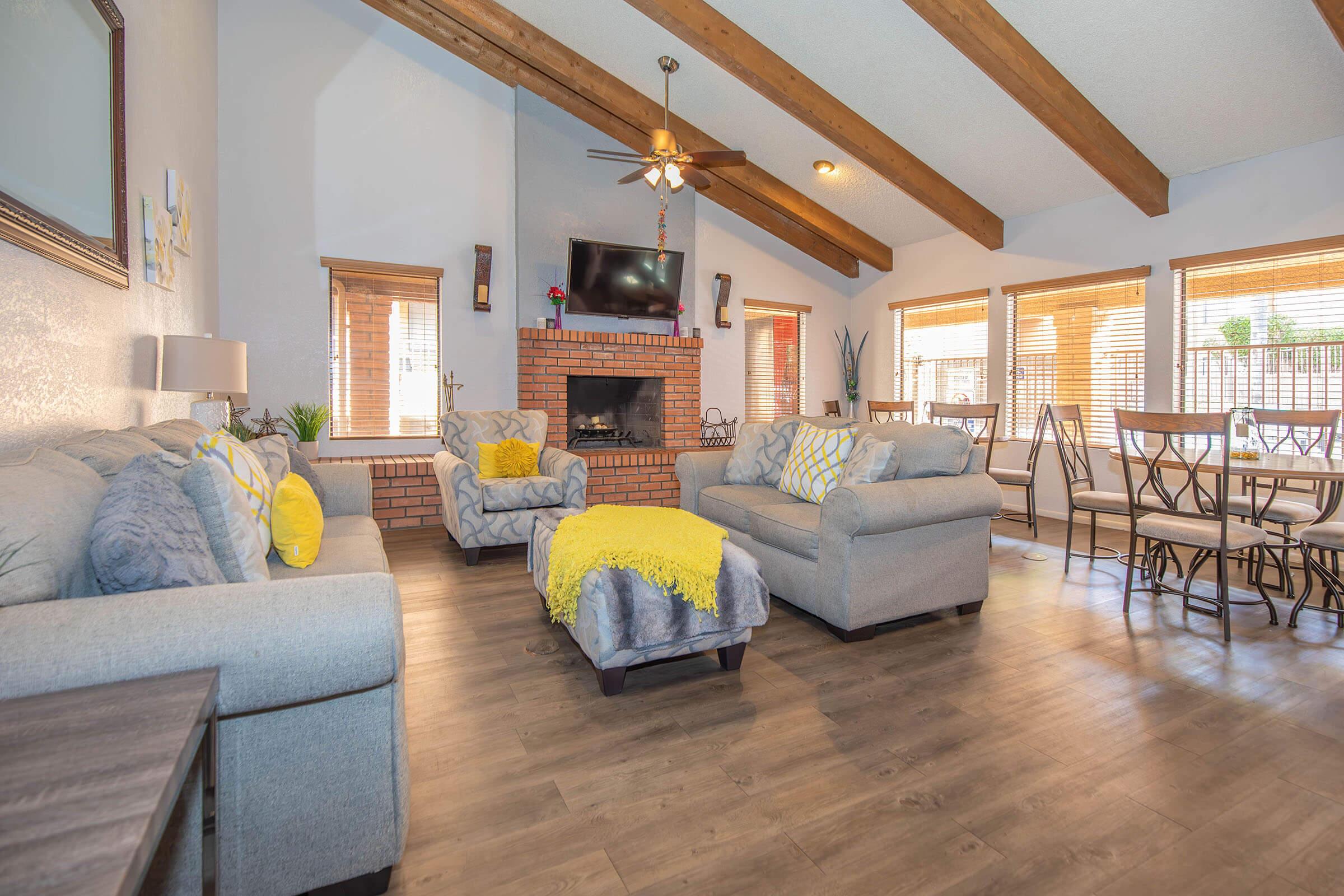 a living room filled with furniture and a fireplace