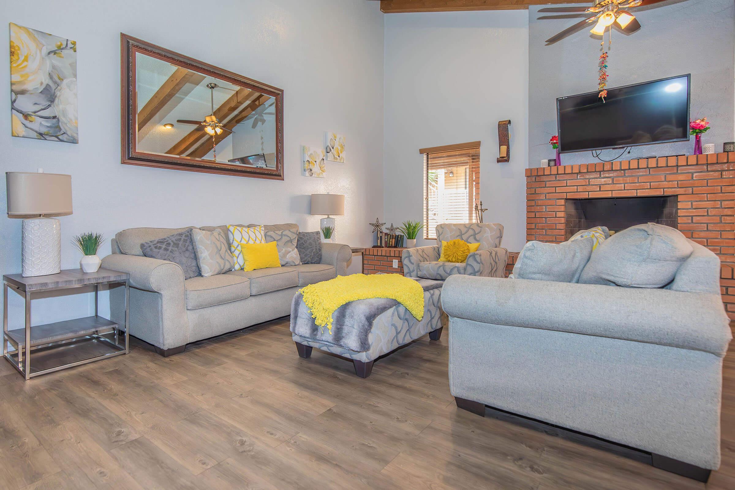 a living room filled with furniture and a fireplace