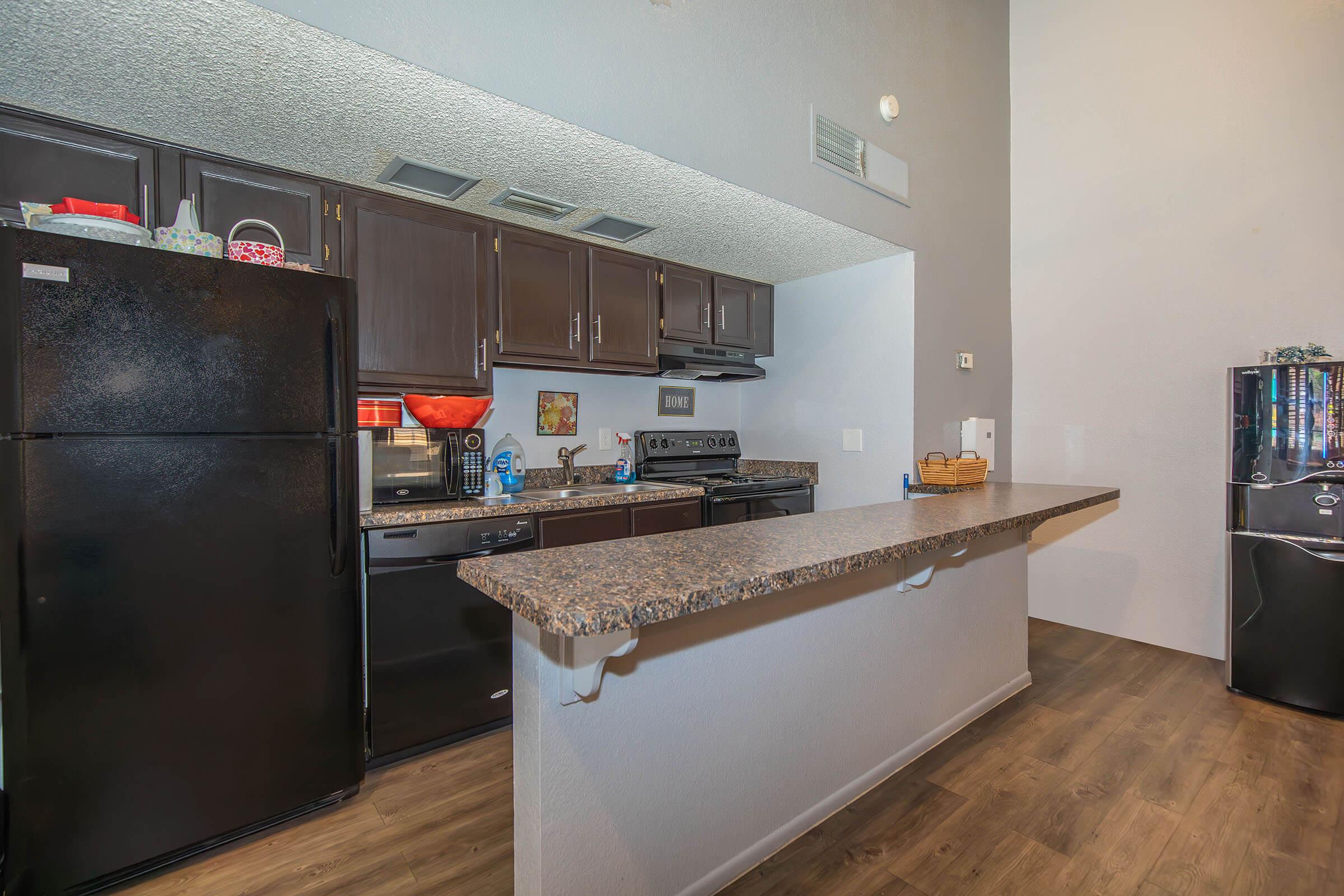 a large kitchen with stainless steel appliances