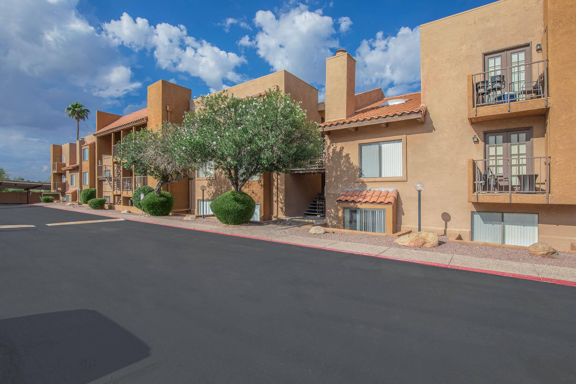 an empty road in front of a building