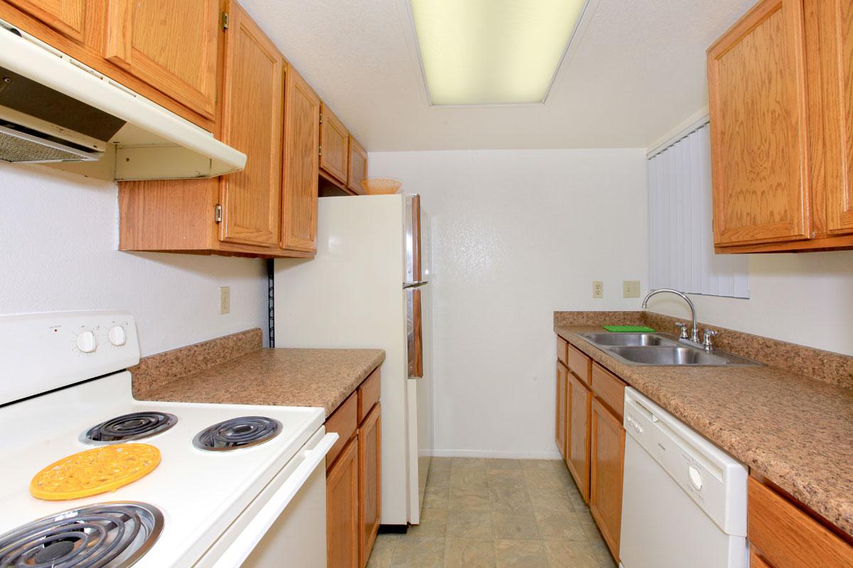 a kitchen with a stove a sink and a microwave