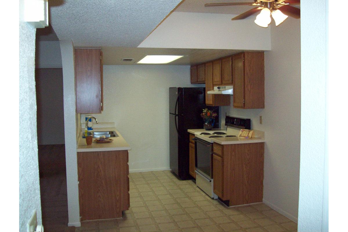 a kitchen with a sink and a refrigerator