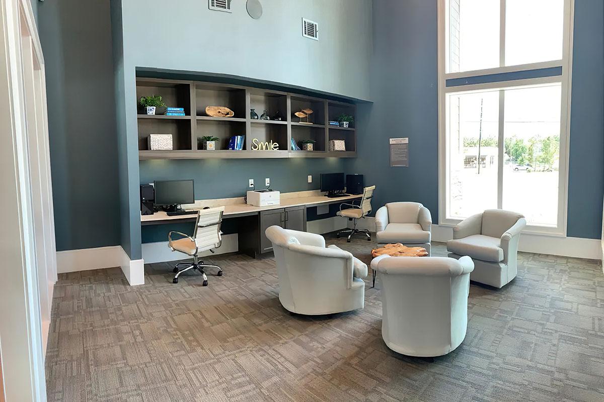 a room filled with furniture and a large window