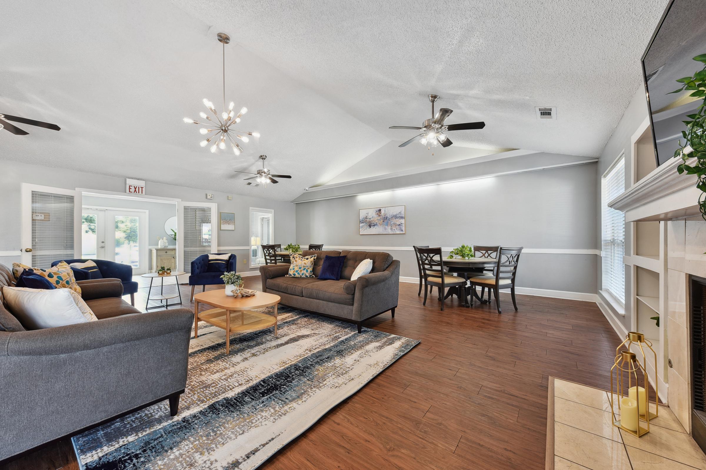 a living room filled with furniture and a table