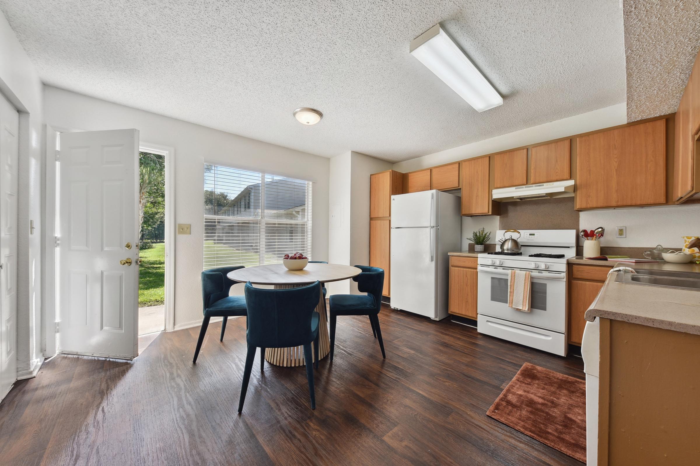 a room filled with furniture and a house in the kitchen