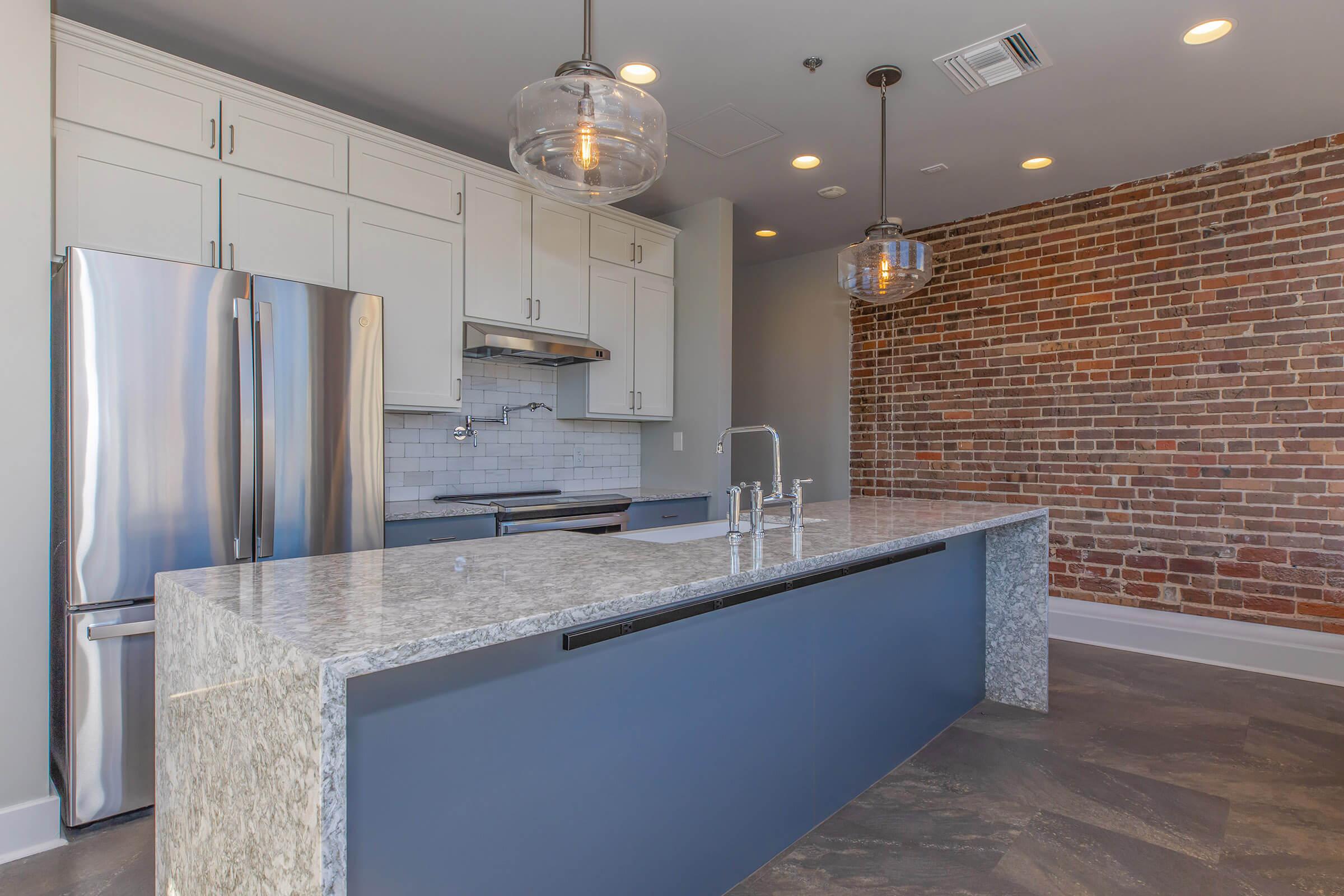 a modern kitchen with stainless steel appliances