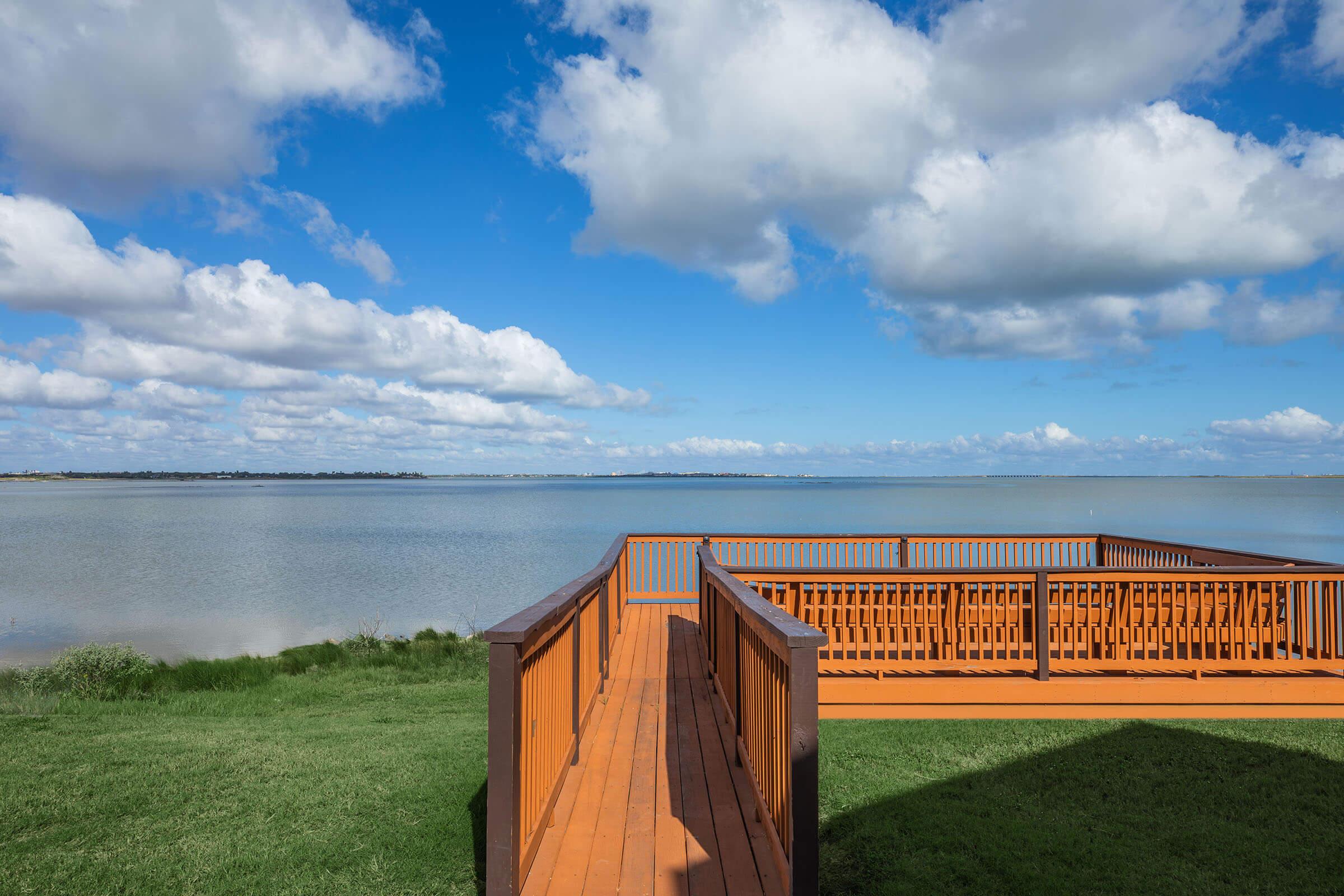 a bench in front of a body of water