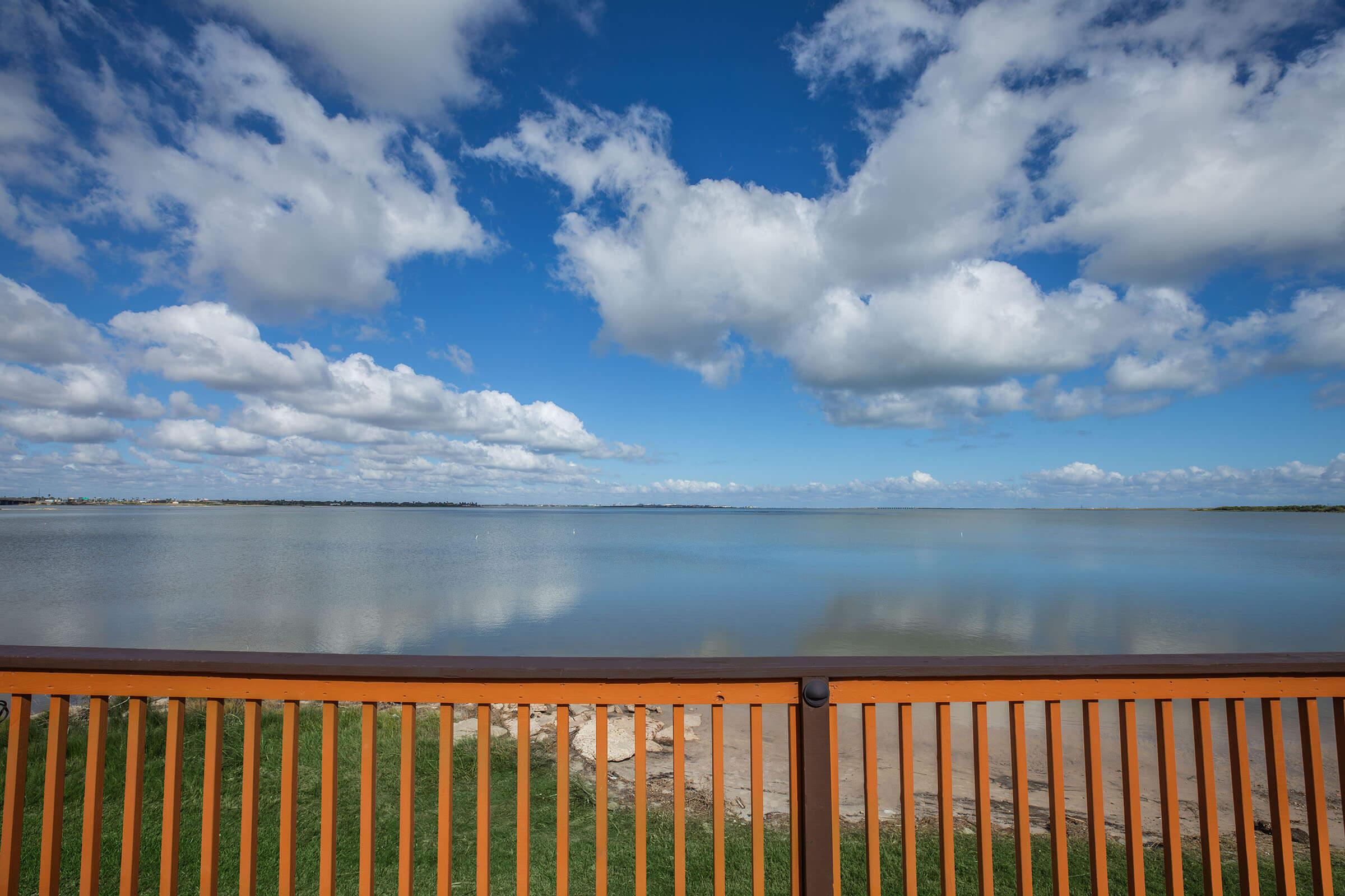 a bench in front of a body of water