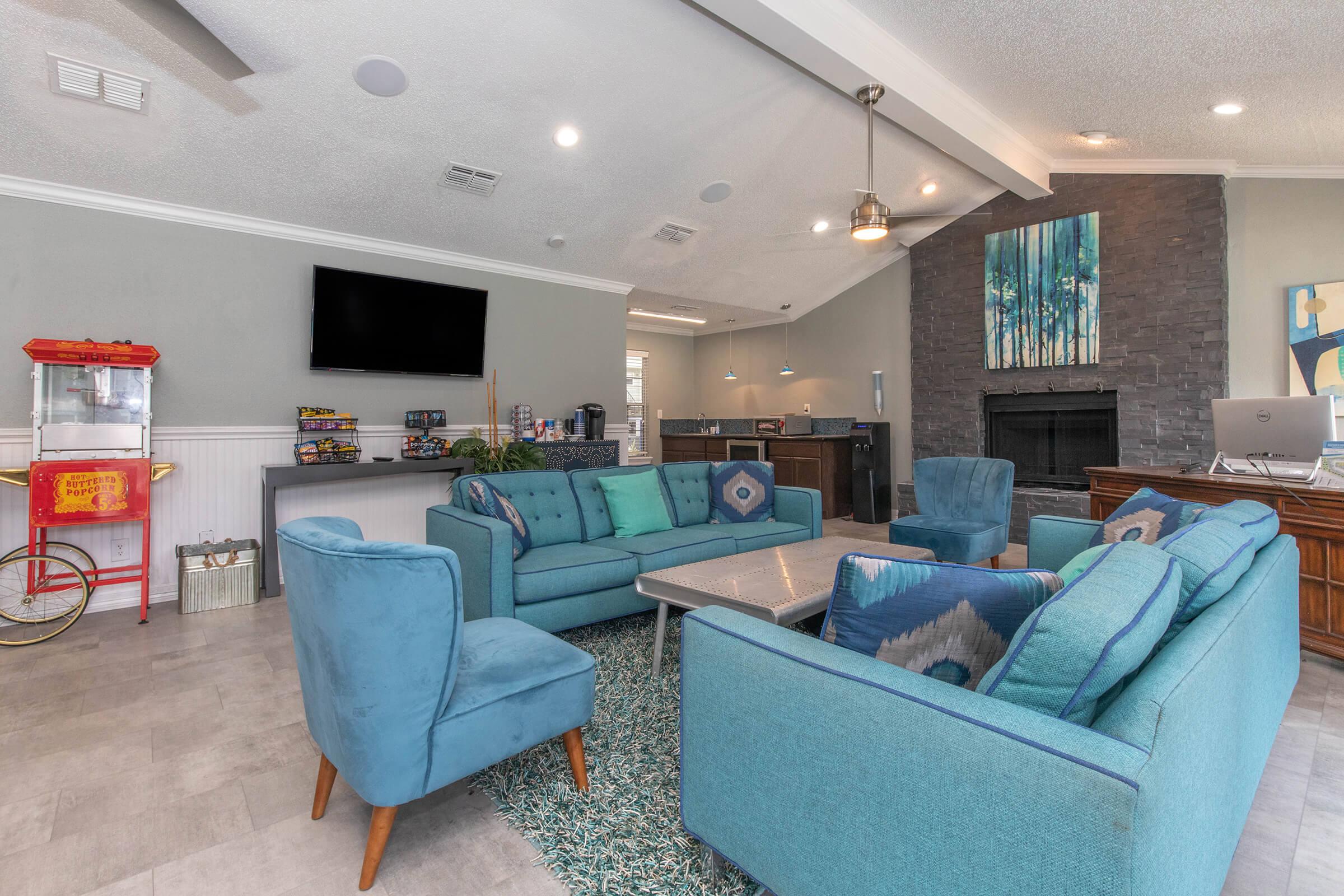 a living room filled with furniture and a fireplace