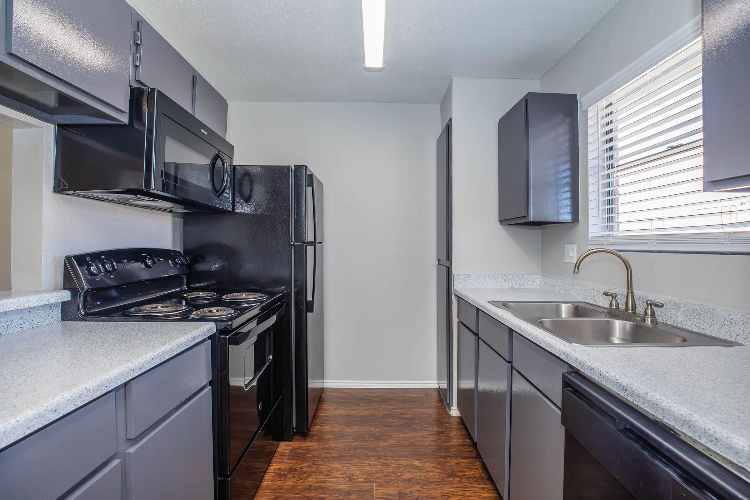 a large kitchen with stainless steel appliances