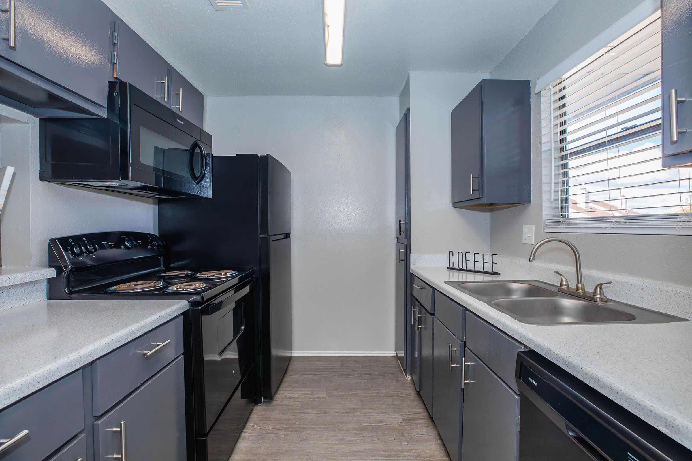 a kitchen with a stove and a sink