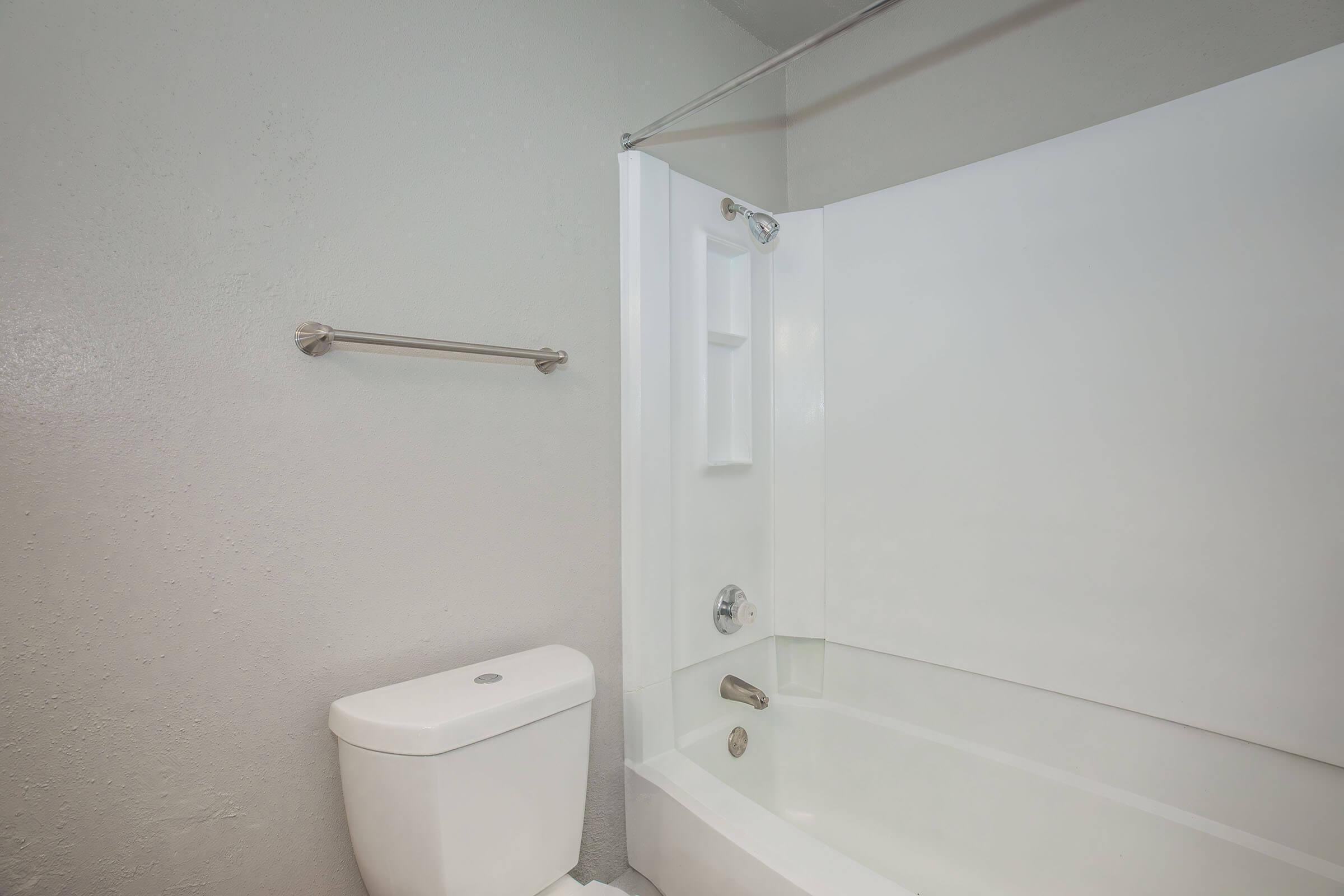 a shower that has a sink and a mirror