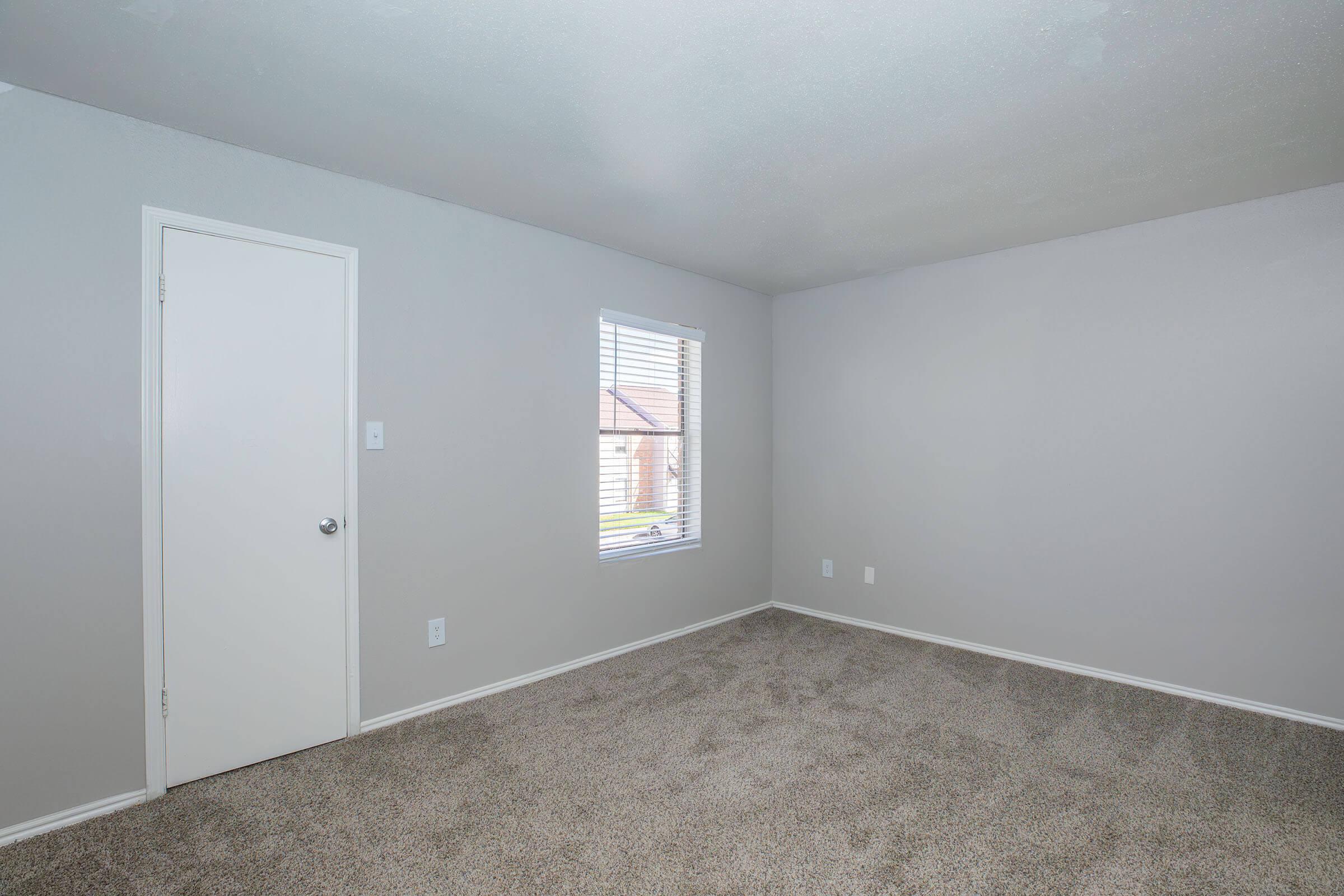 a bedroom with a large mirror