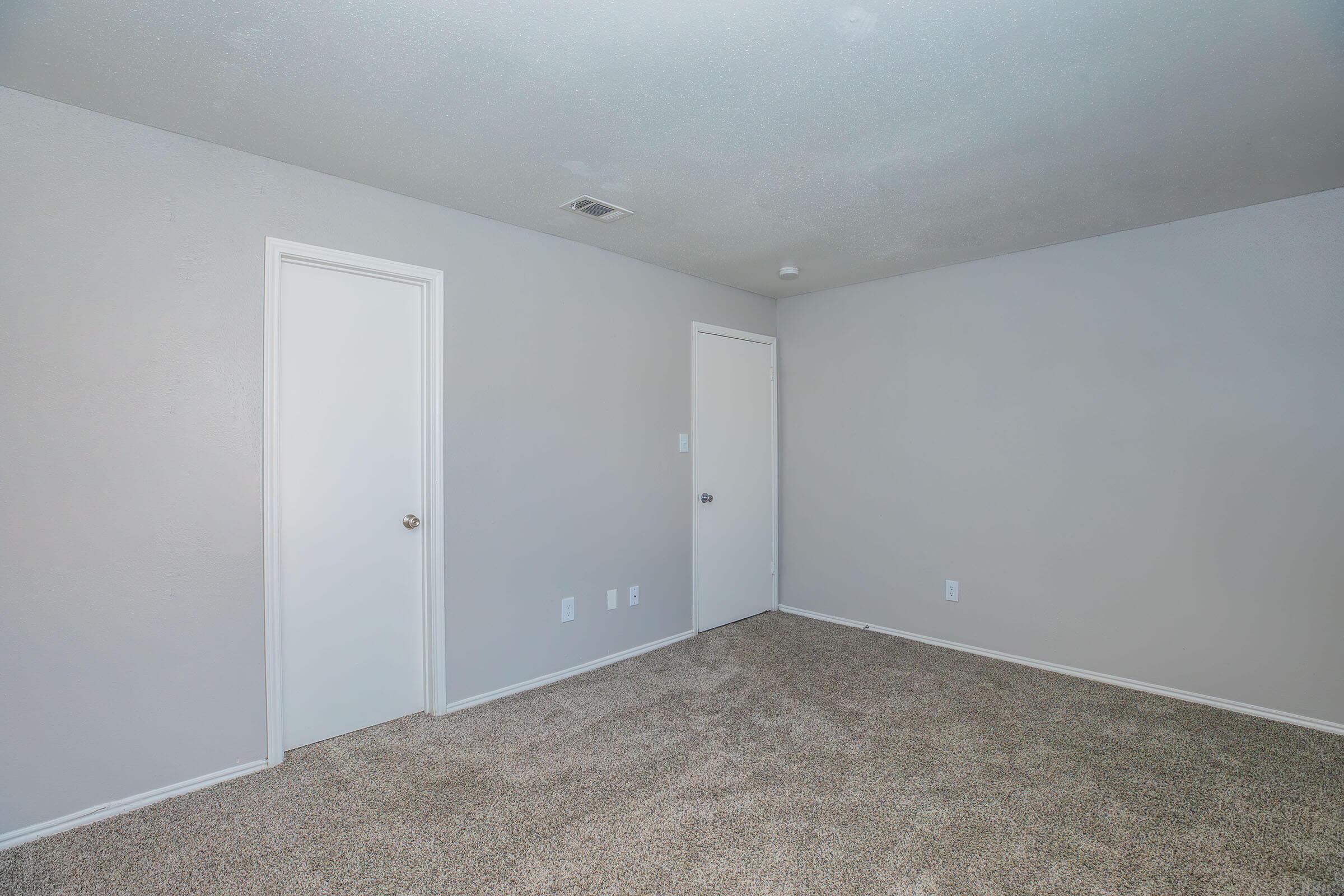 a bedroom with a large mirror