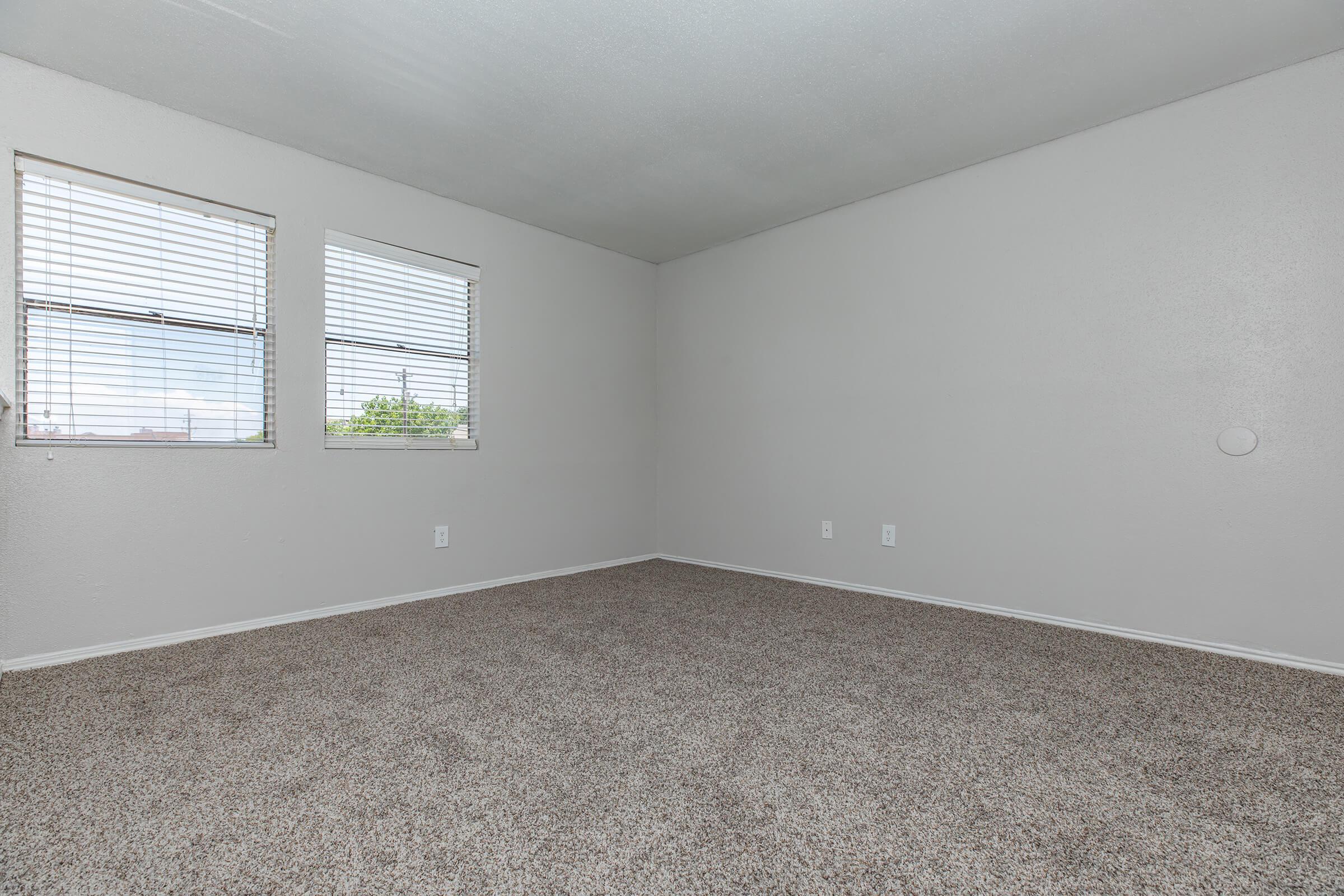 a bedroom with a large window