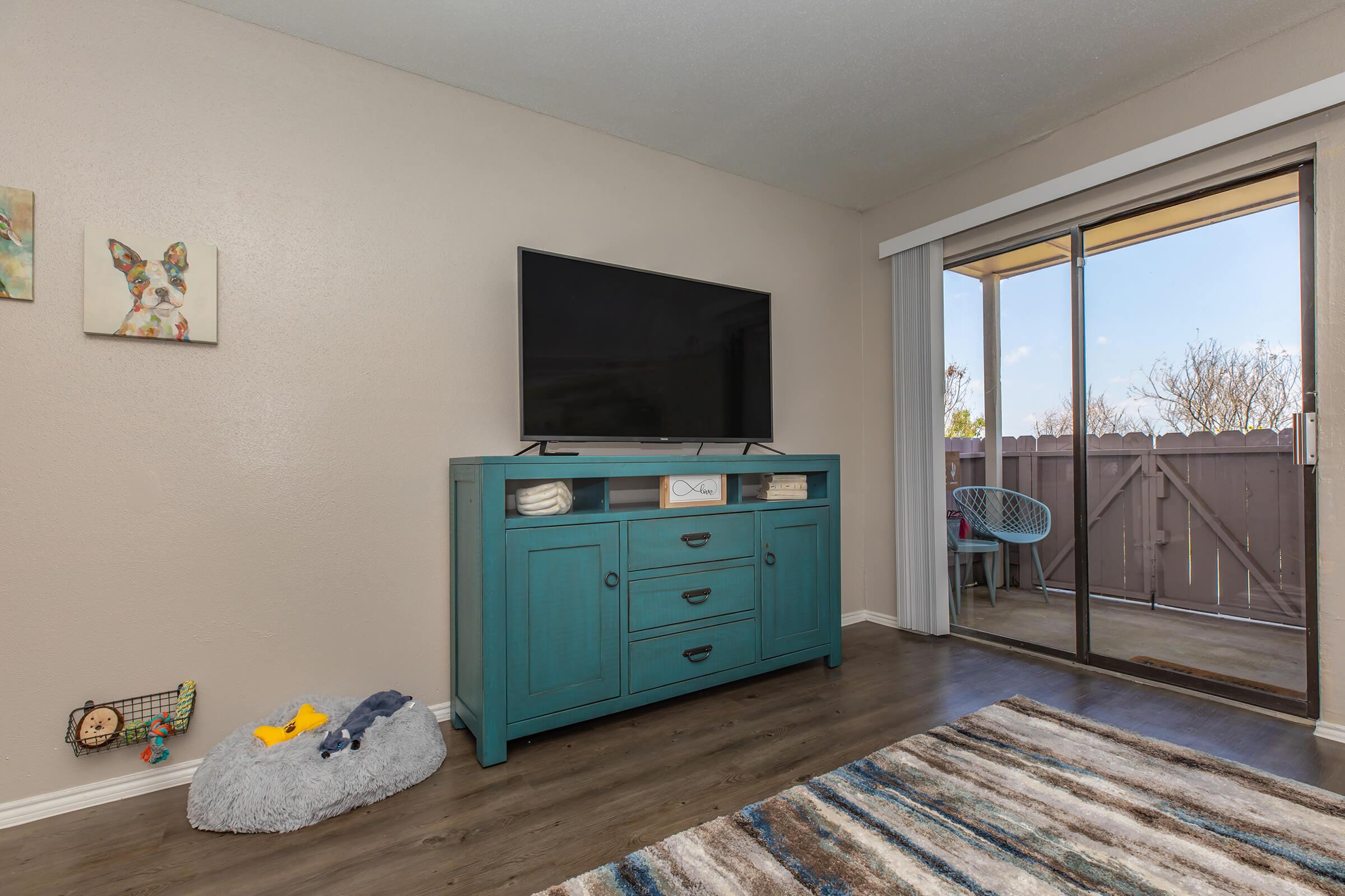 a room filled with furniture and a large window