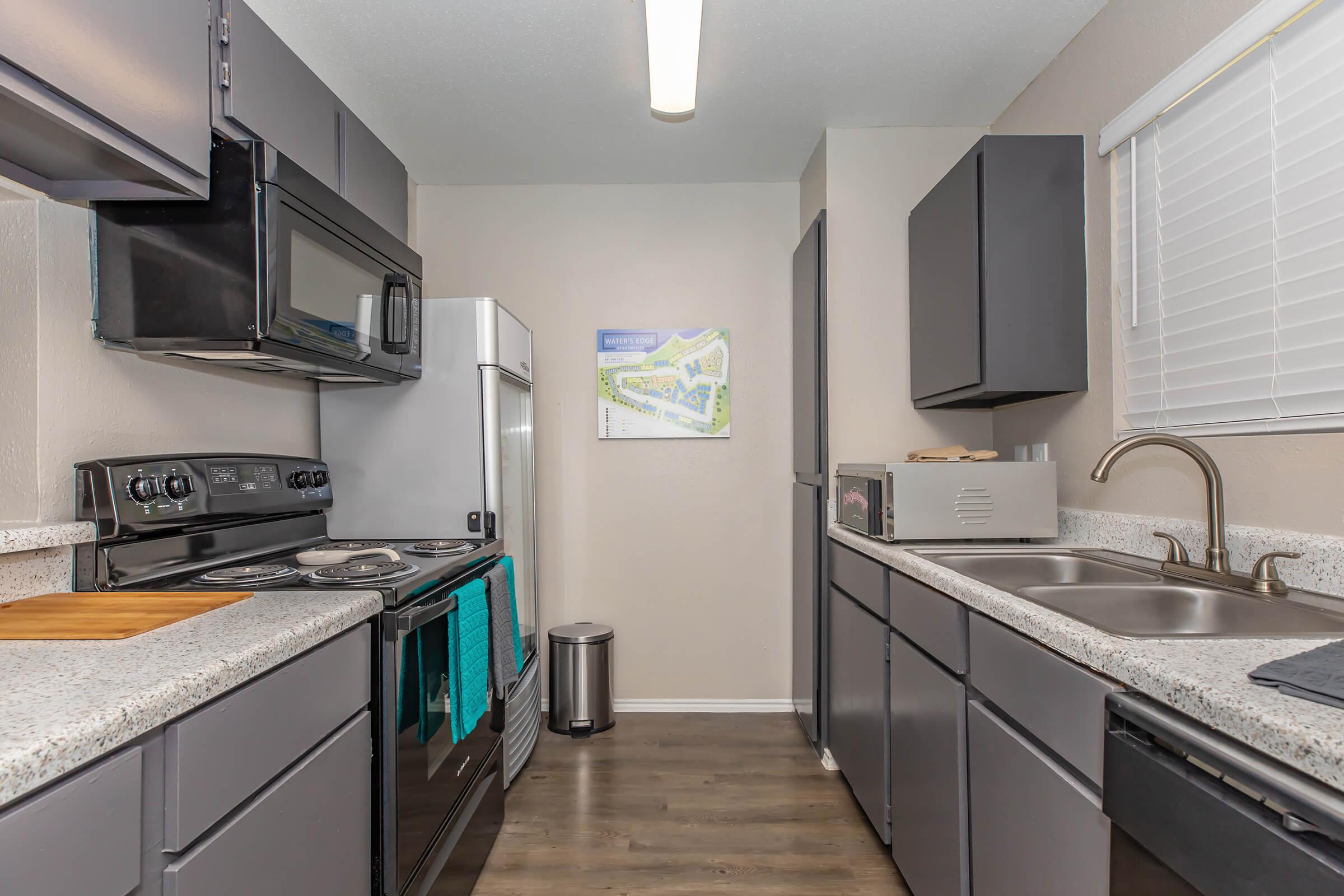 a modern kitchen with stainless steel appliances