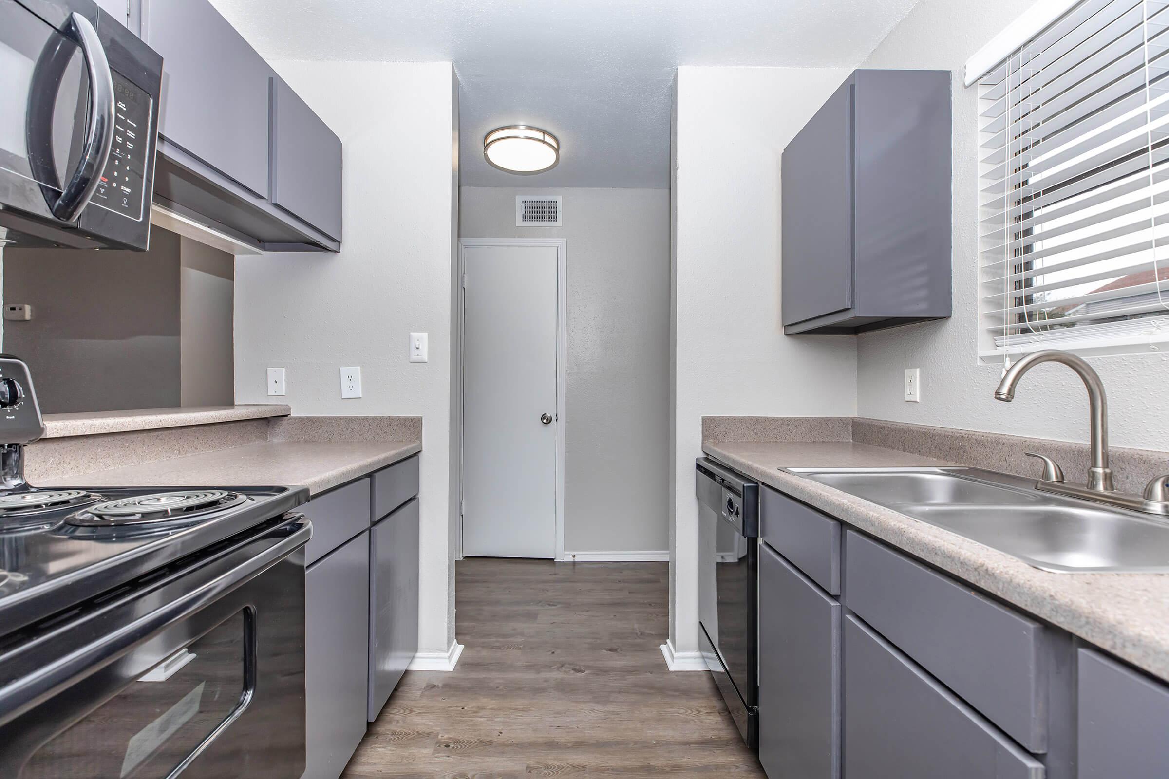 a modern kitchen with stainless steel appliances