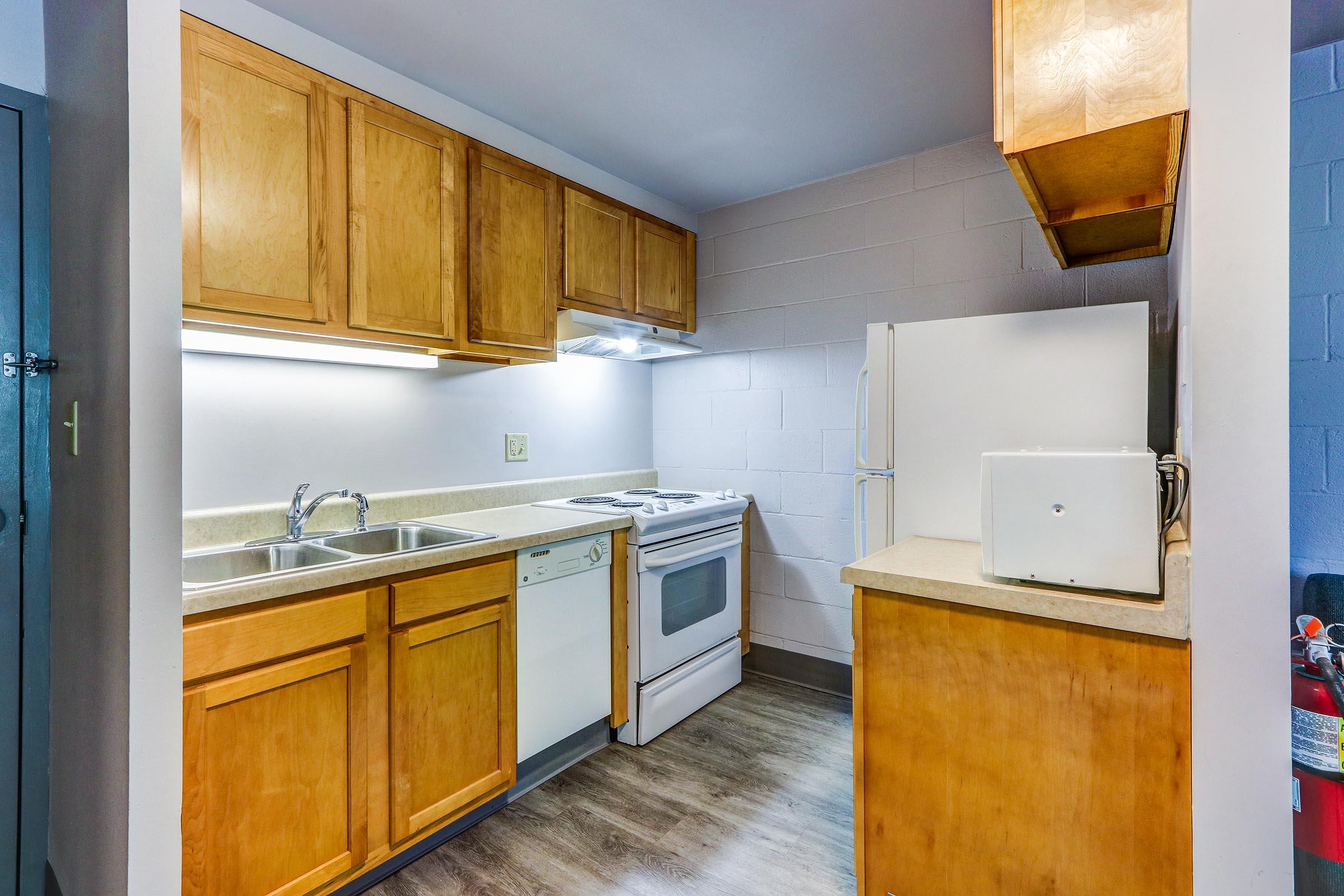 a kitchen with a stove and a refrigerator