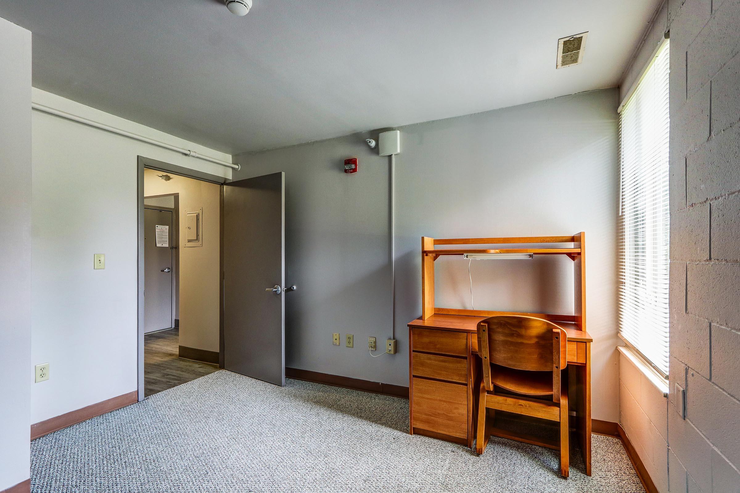 a bedroom with a large mirror