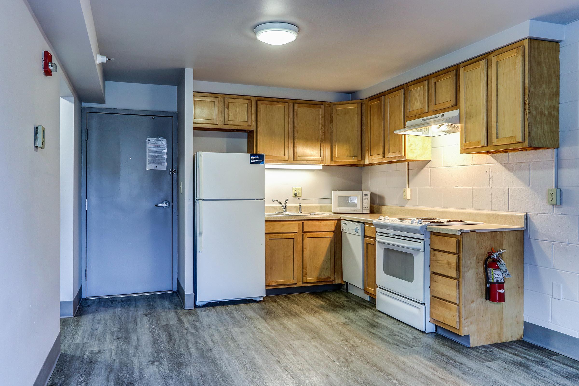 a kitchen with a stove and a refrigerator