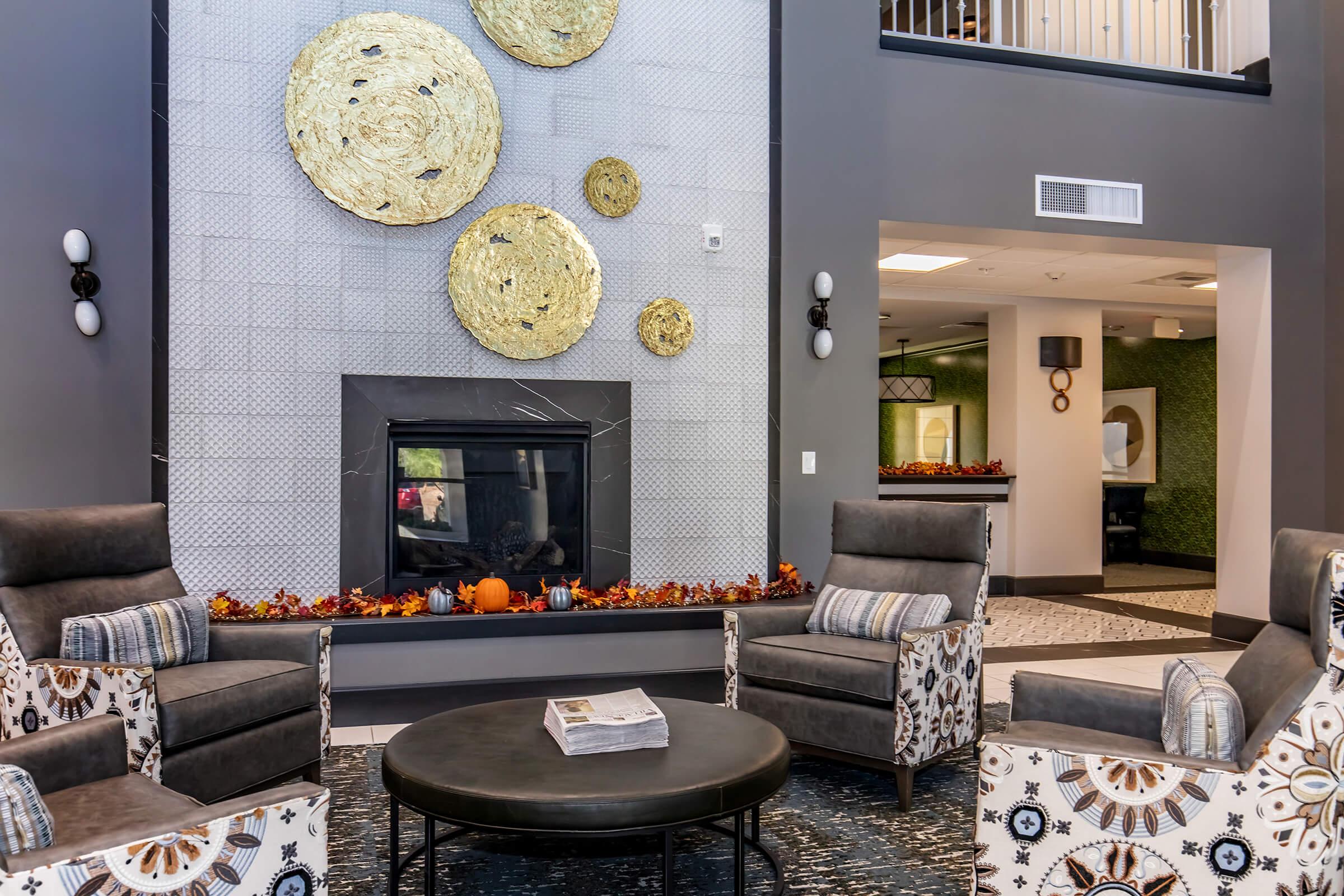 a living room filled with furniture and a fire place