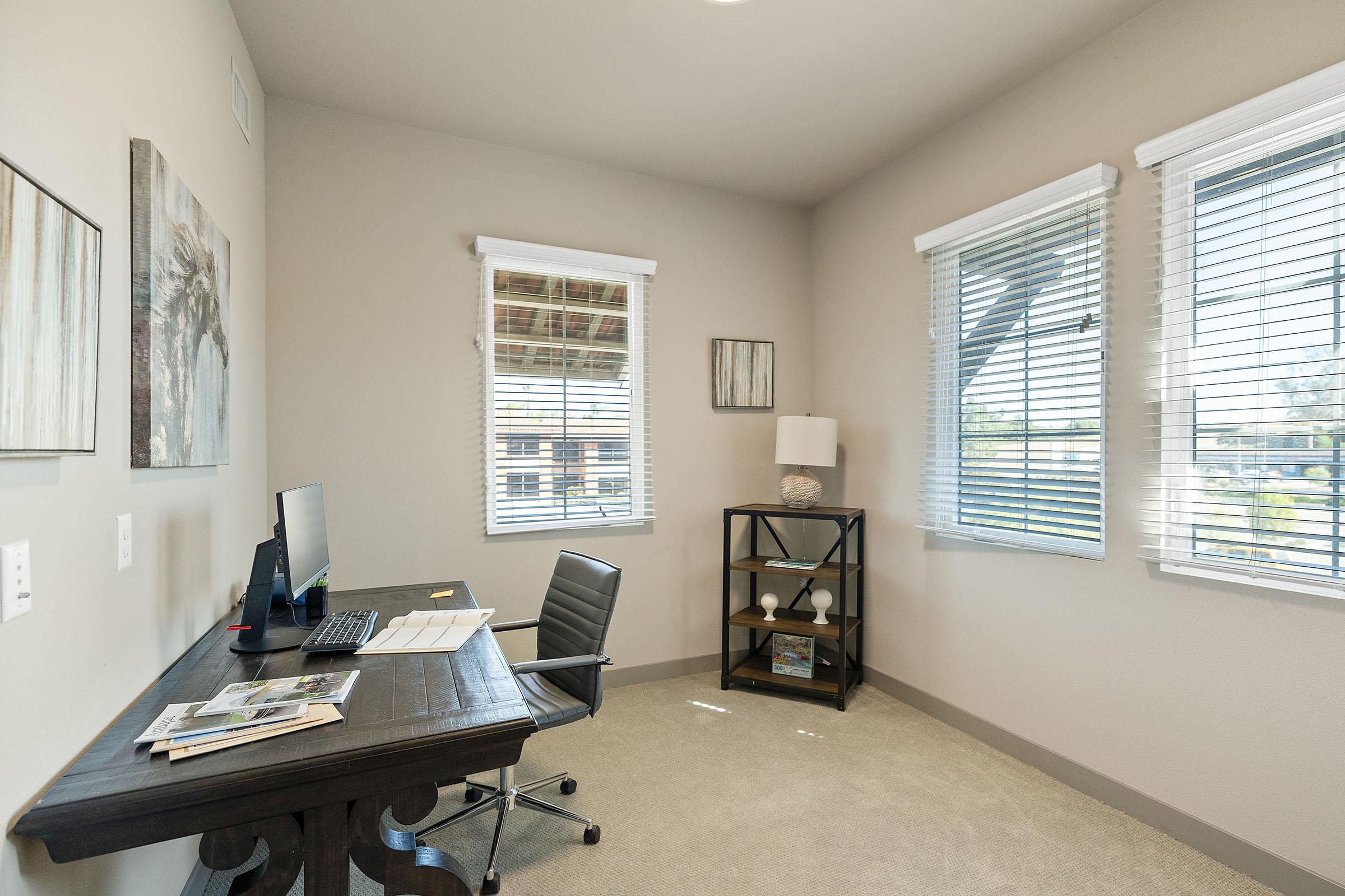 a room filled with furniture and a large window