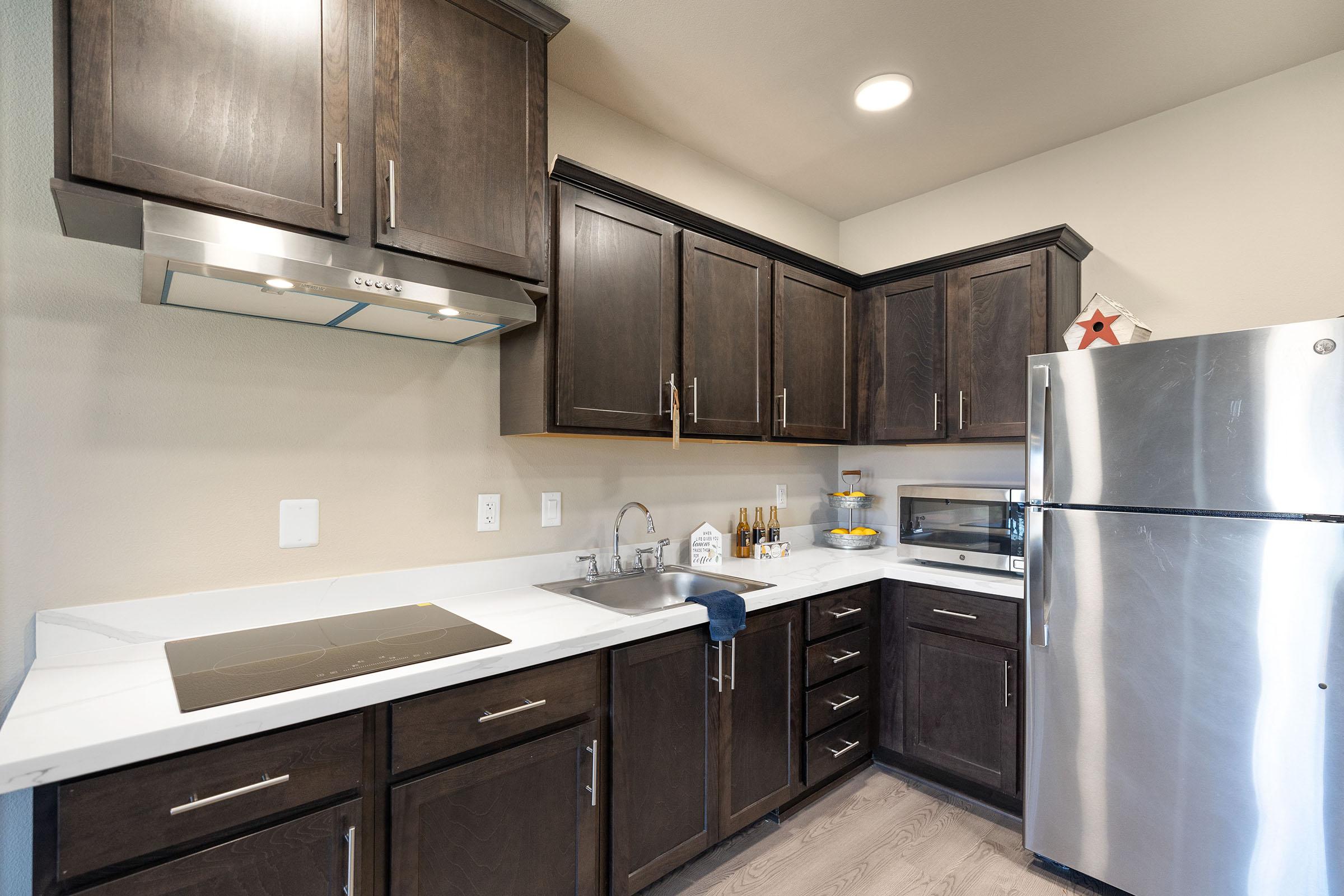 a modern kitchen with stainless steel appliances