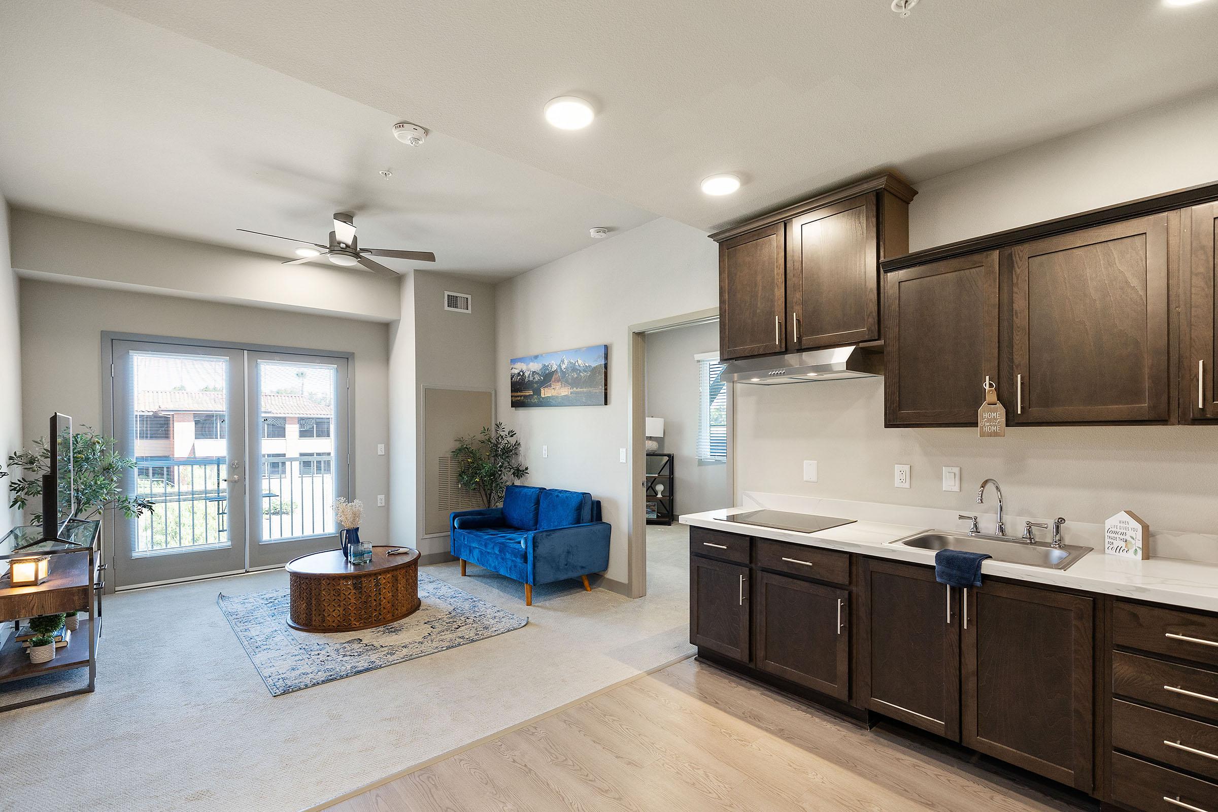 a room filled with furniture and a sink