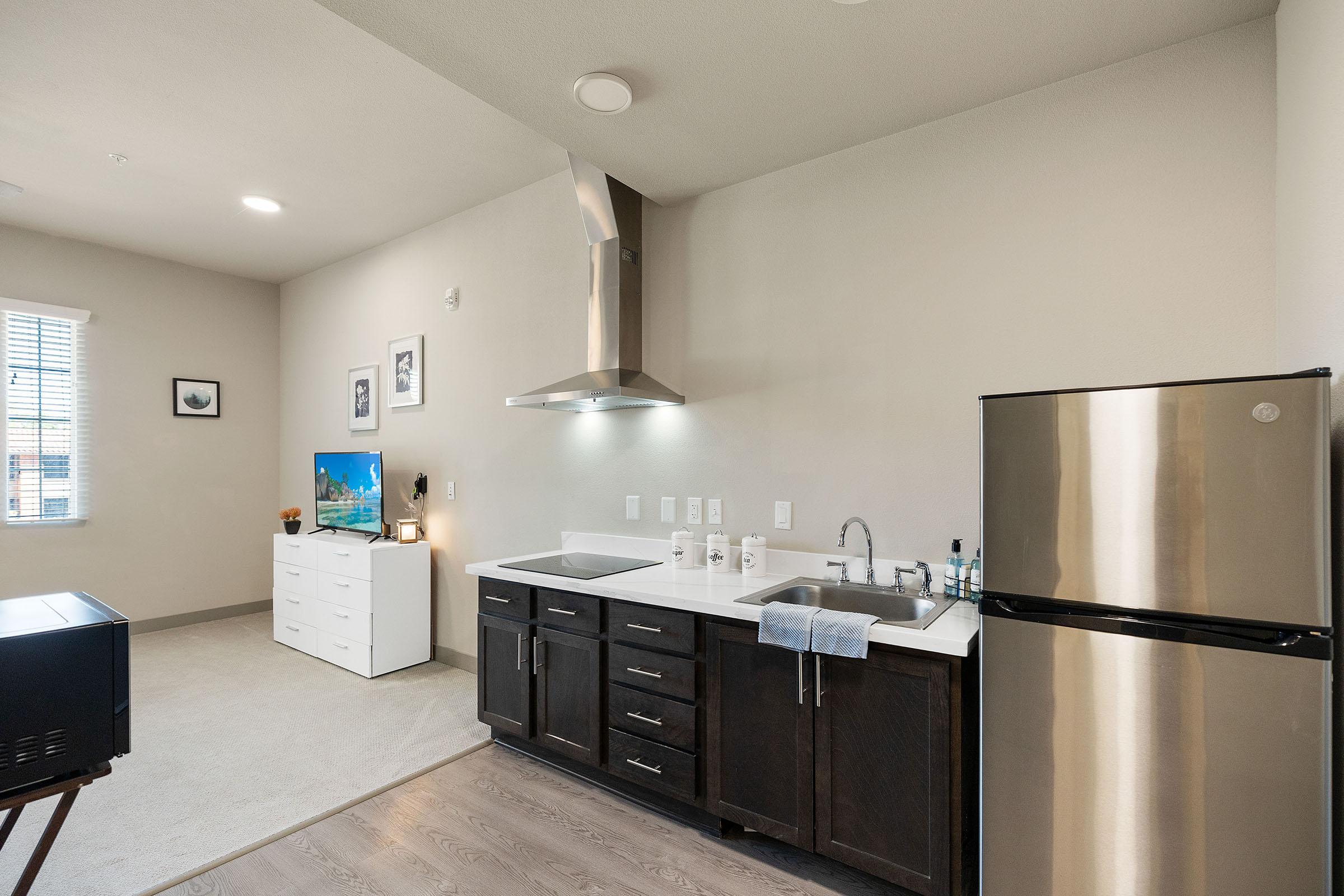 a modern kitchen with stainless steel appliances