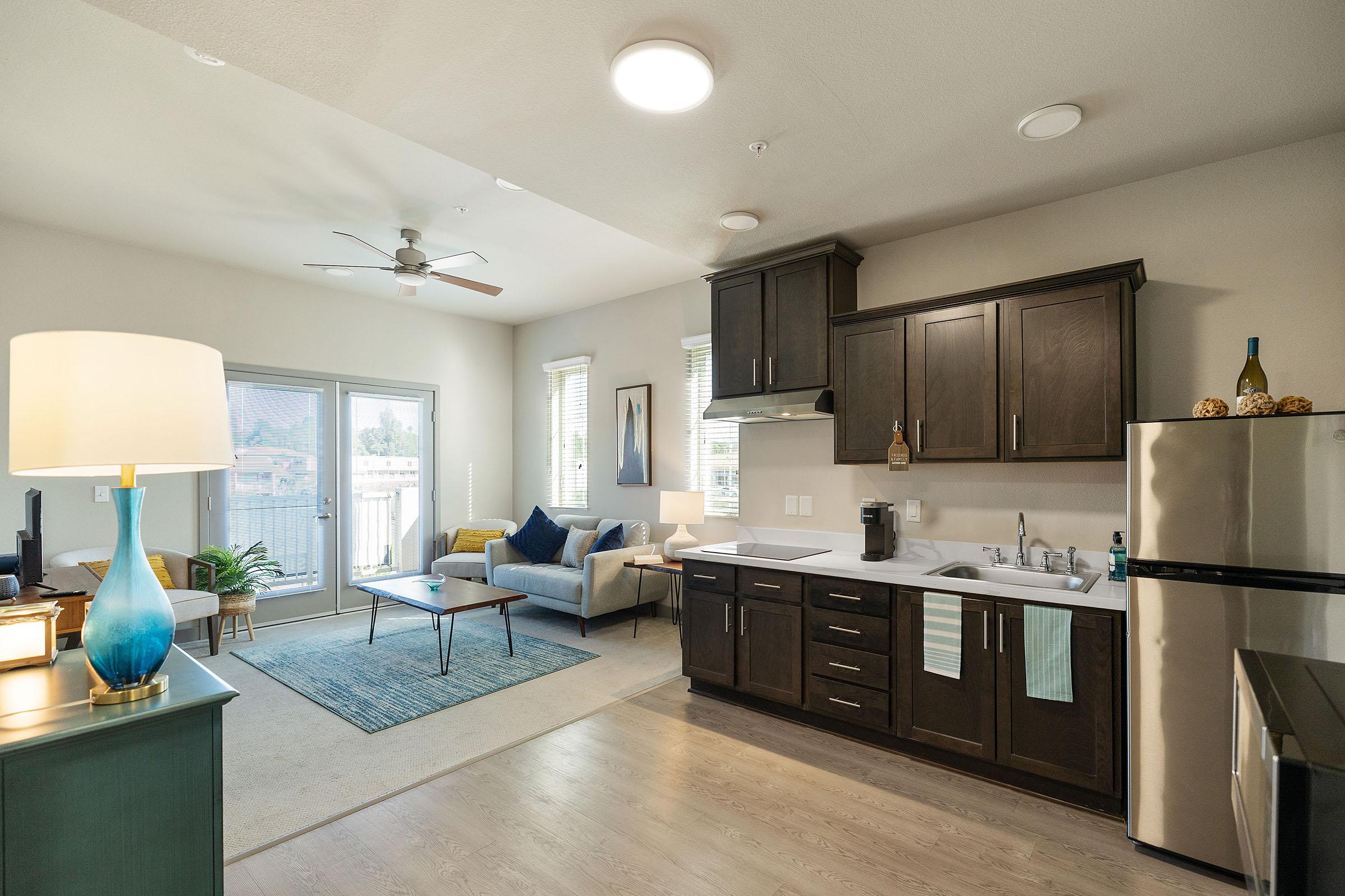 a kitchen with an island in the middle of a room