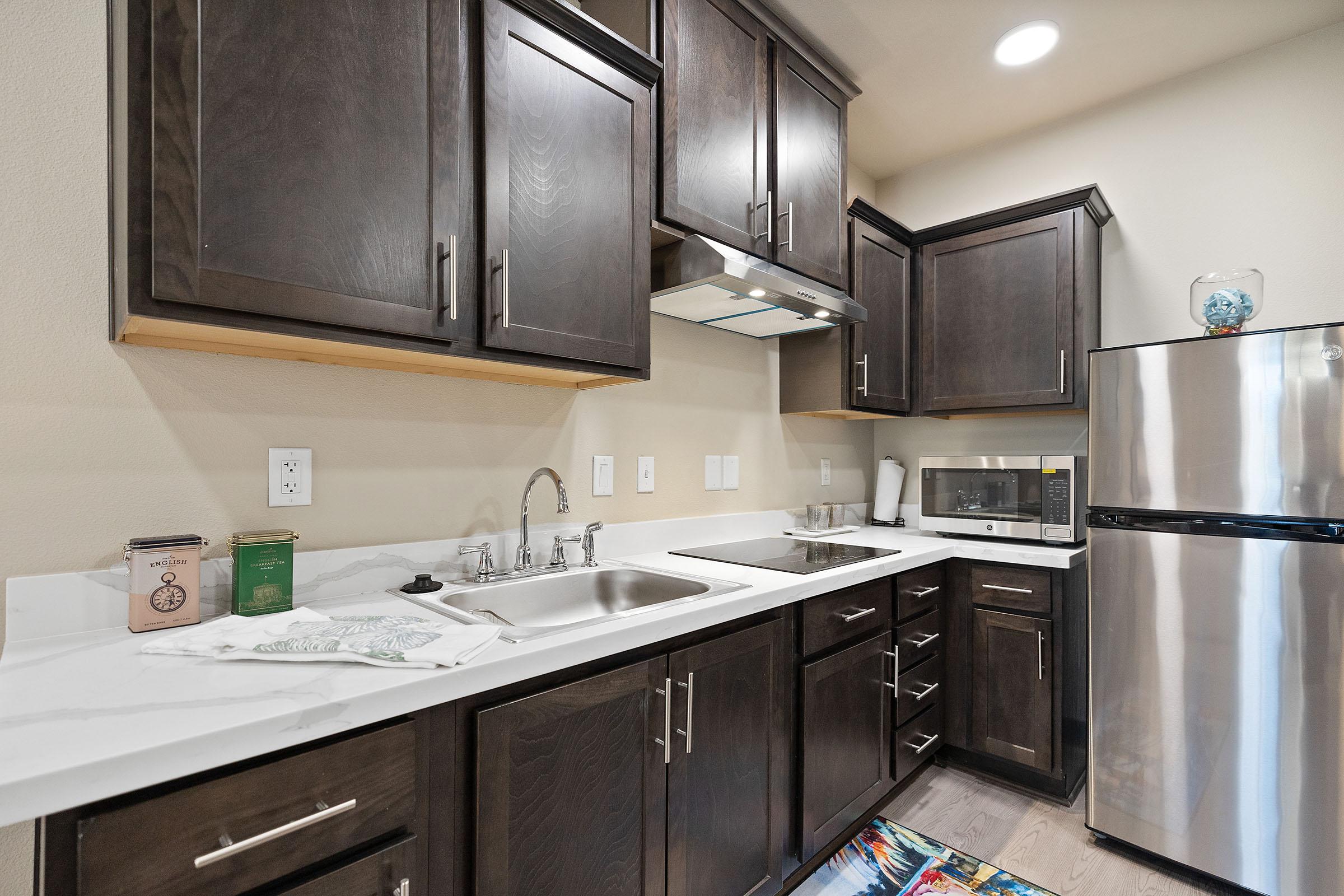 a kitchen with a stainless steel sink