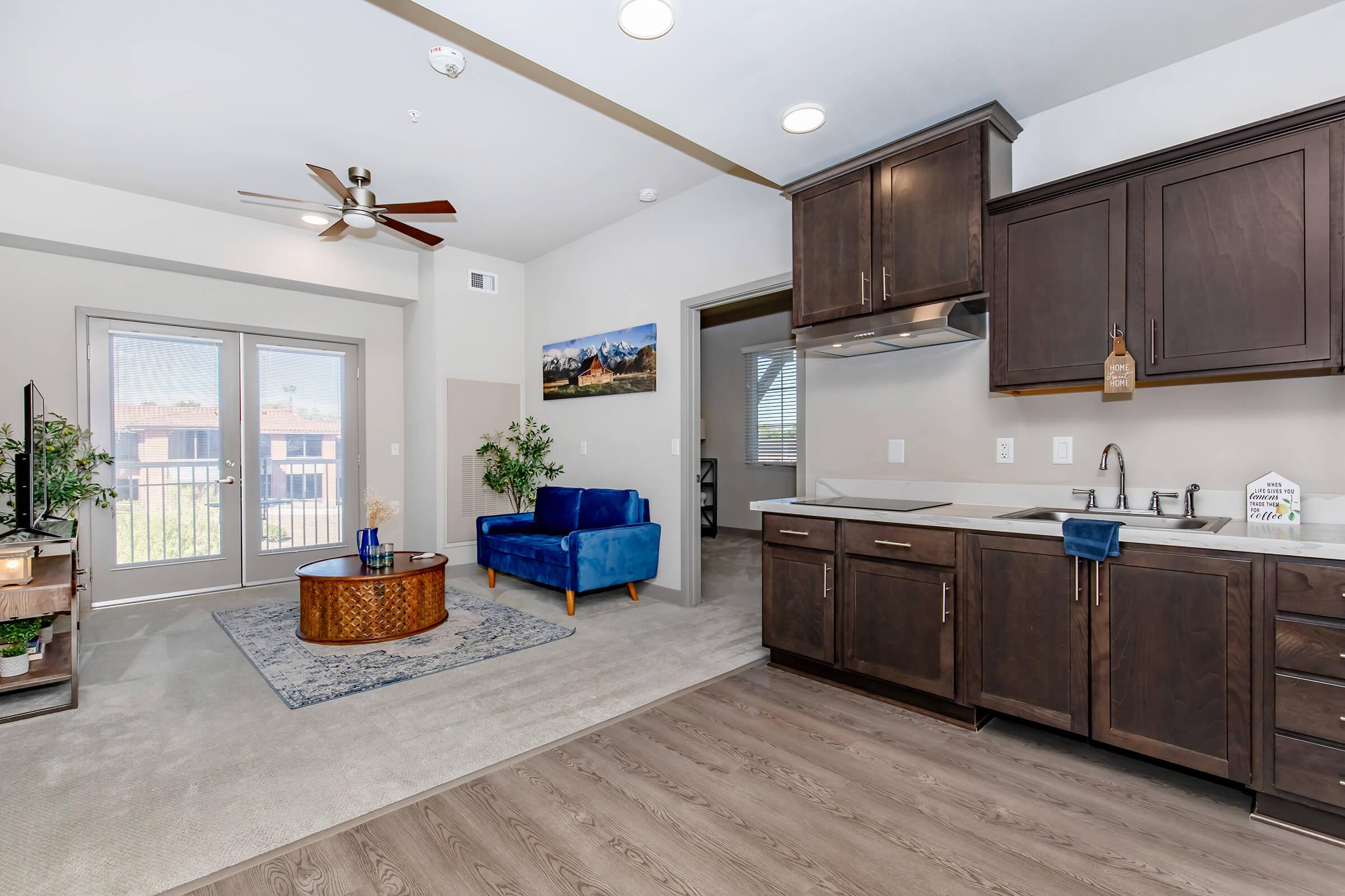 a kitchen filled with lots of furniture