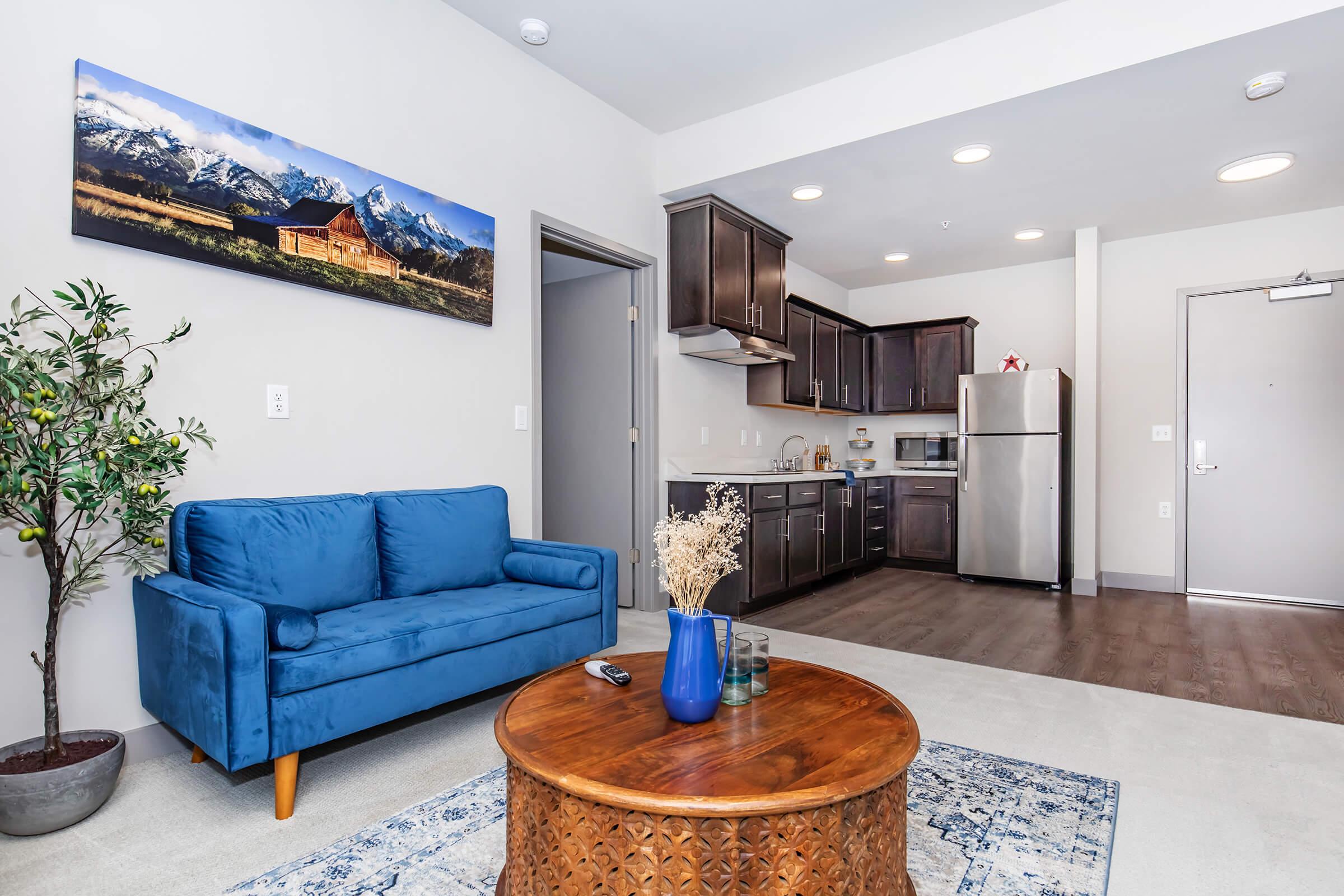 a living room filled with furniture and a fireplace